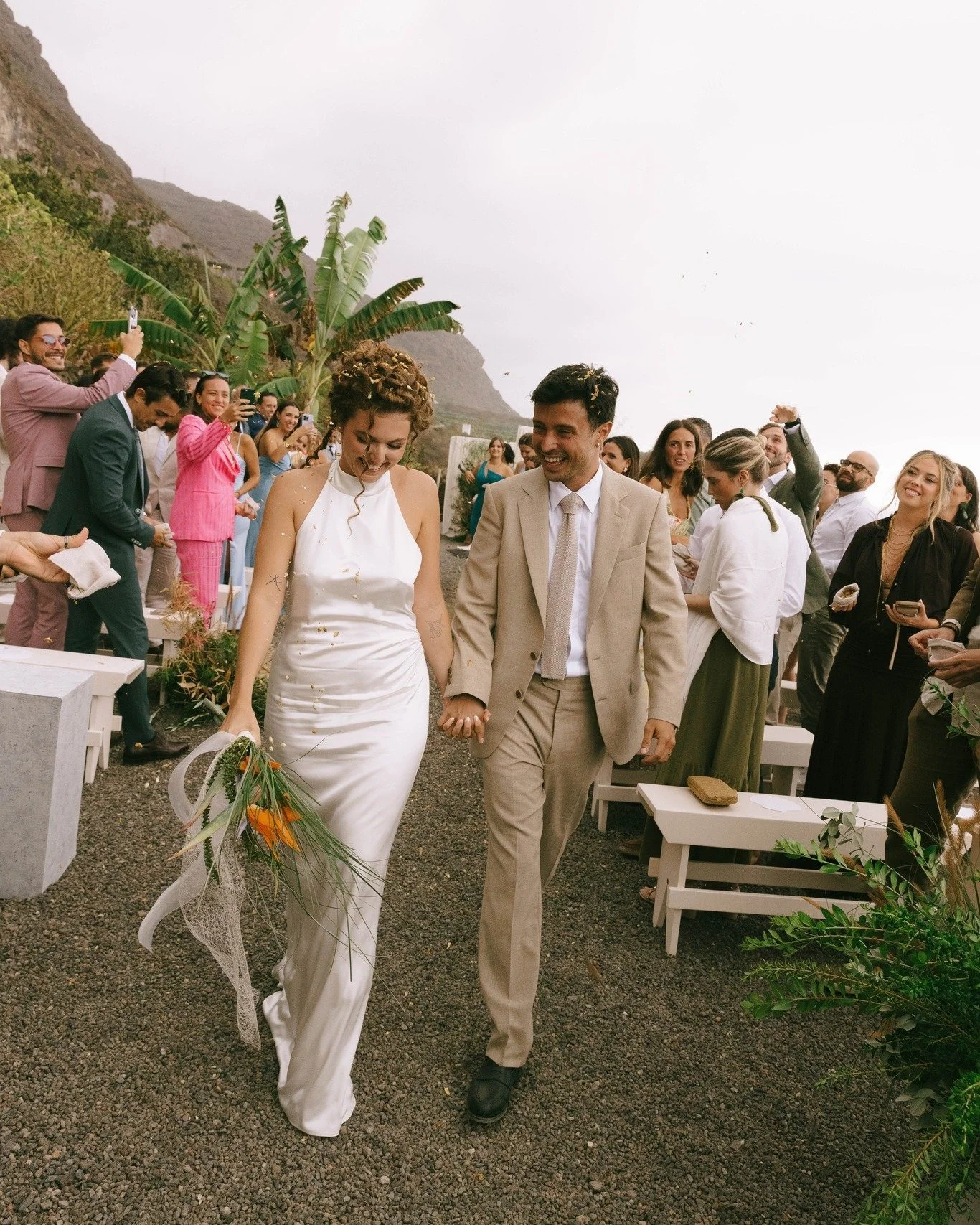 REAL BRIDE // Virginia + Reginaldo

For her celebration in Tenerife, Virginia chose a bespoke gown inspired by the landscape that surrounded her: the ocean&rsquo;s soft waves, the organic forms of nature, and the effortless beauty of the island. Blen