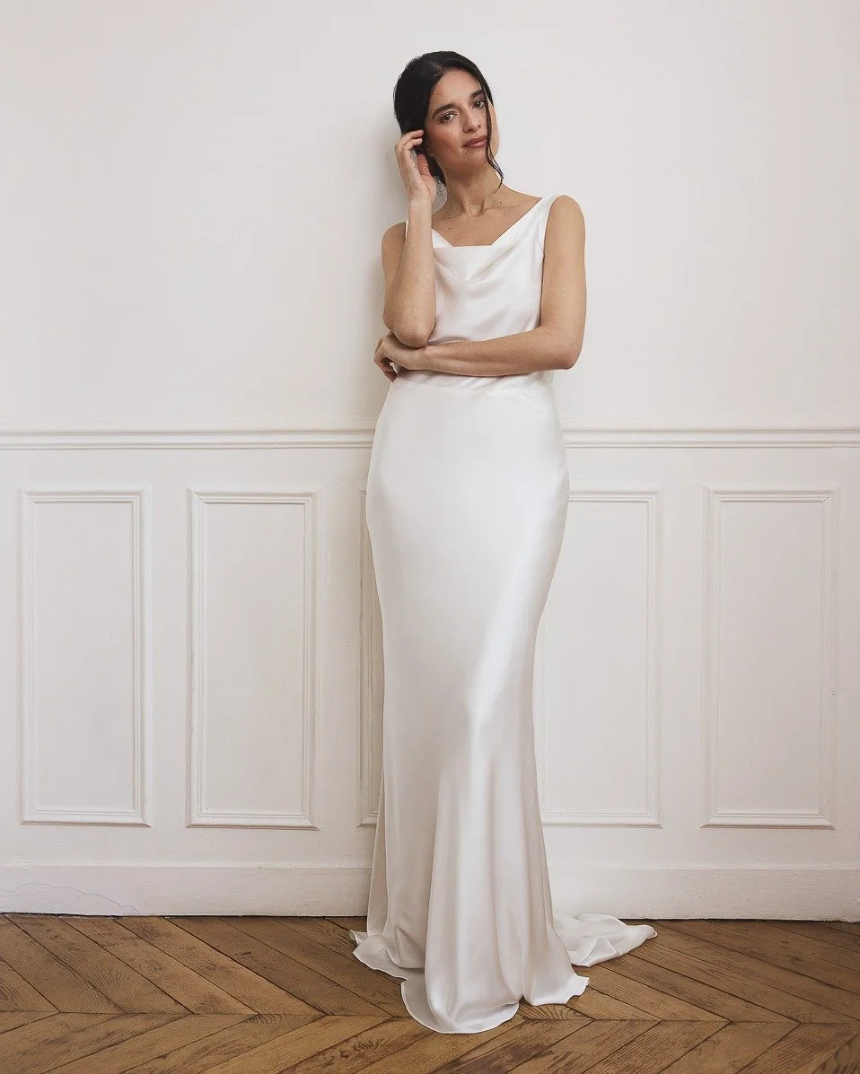 SLOANE is a bias-cut silk satin gown that moves effortlessly with the body. A soft waterfall neckline in the front, a deep V-back cut out, and a subtle train to finish.

For the Kladek bride &mdash; modern and understated, who confidently dresses for