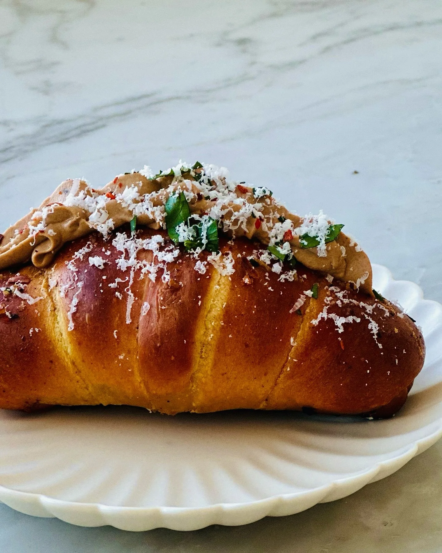 Where warmth, restraint, and umami meet.

Shio pan is a Japanese bread rooted in simplicity&mdash;pillowy crumb, crisp edges, and just enough salt to let everything else shine. We start there, then layer in Hawaij, a traditional Yemeni spice blend of