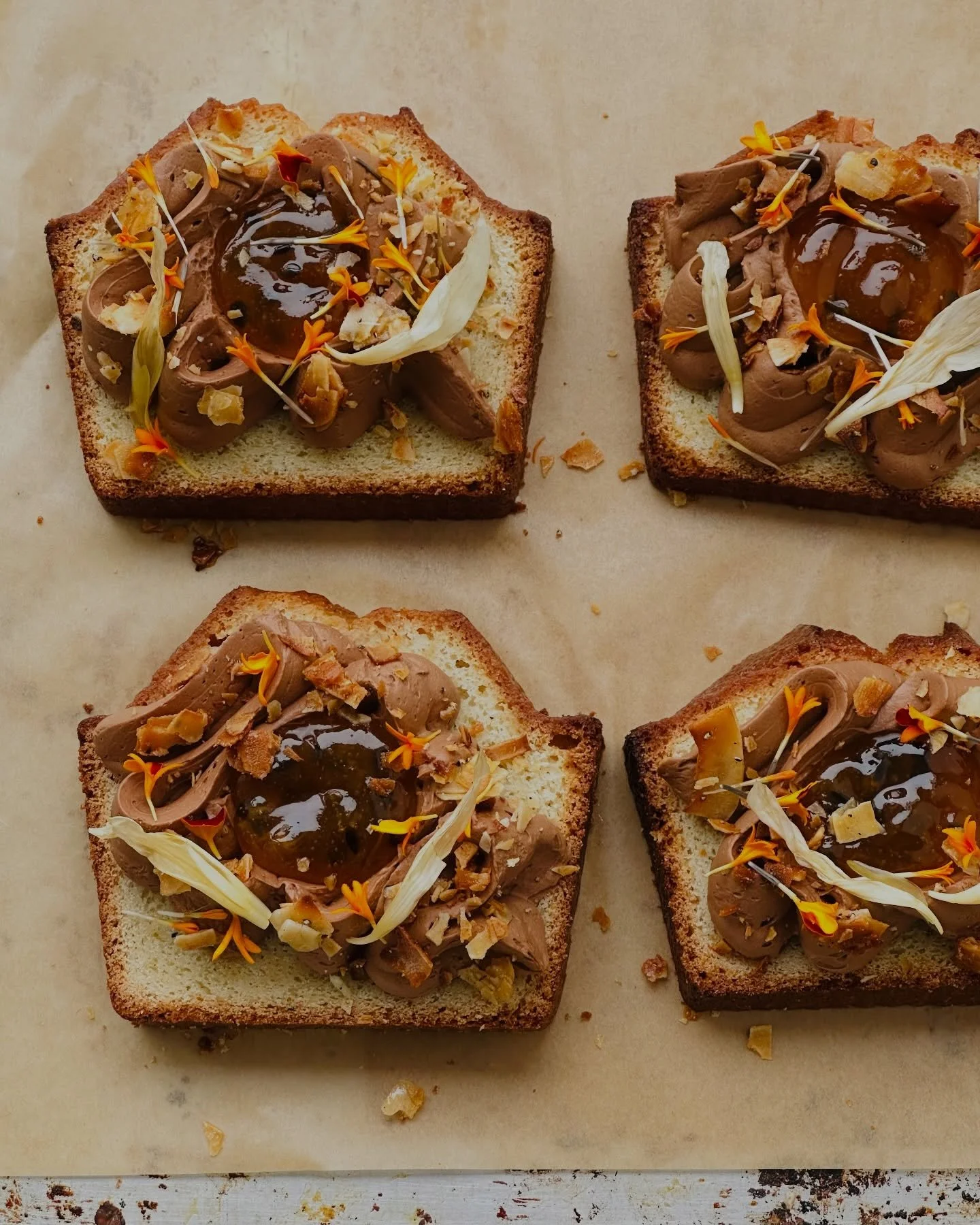 Coconut milk and Kerala green cardamom pound cake, layered with passionfruit ganache and jam, finished with coconut chips and edible flowers. Fragrant, softly tropical, and meant to be savored slowly.

Part of the UFS Valentine&rsquo;s Box &mdash; pr