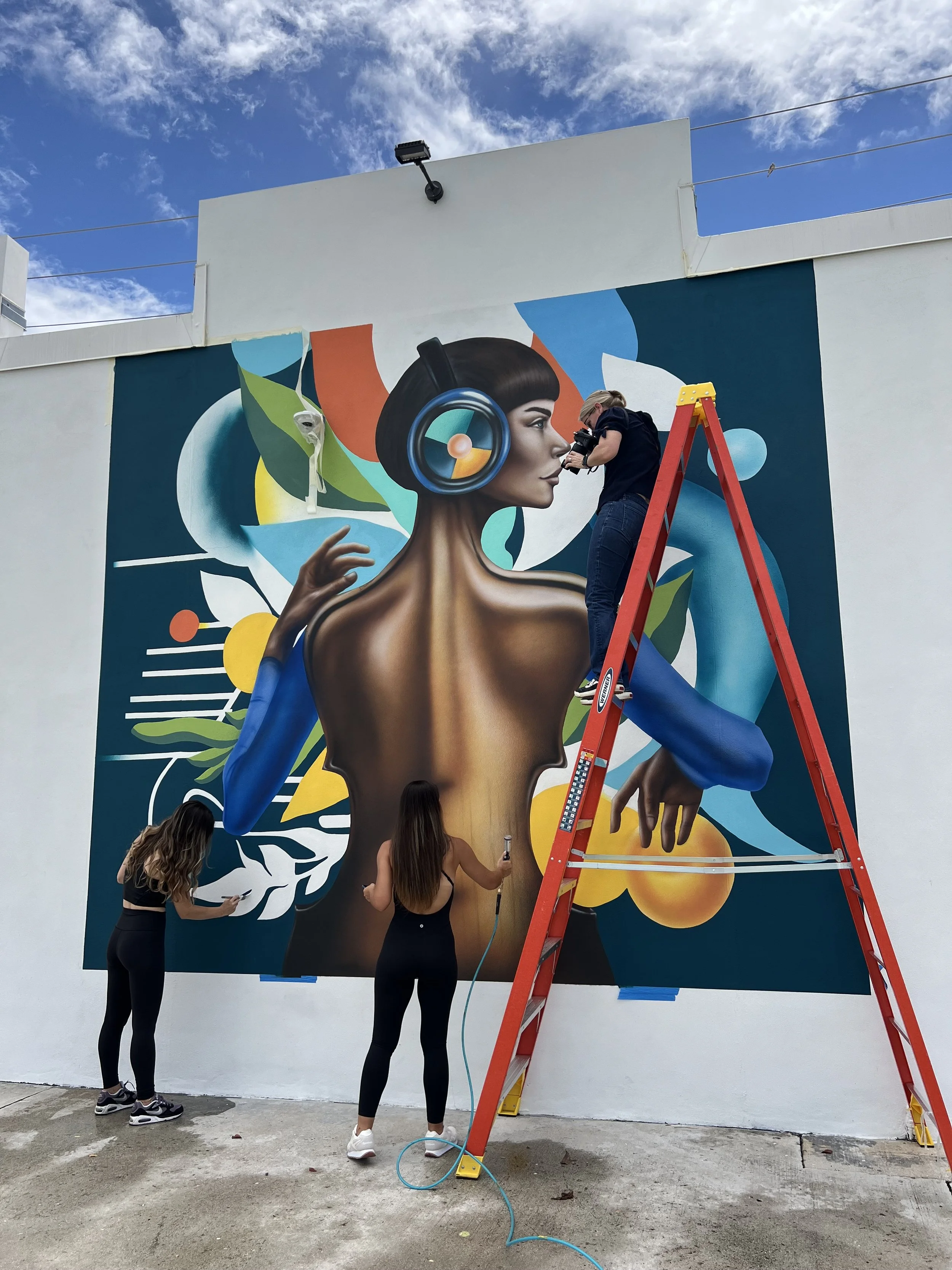 Artists painting the Timeless Fusion public mural on location in Fort Lauderdale
