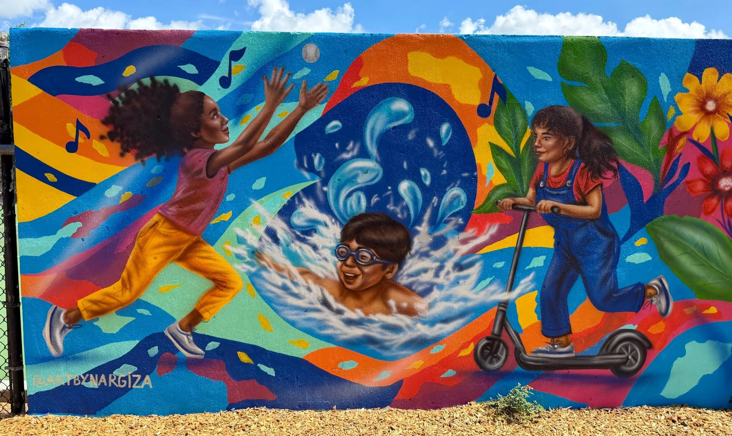 City of Orlando playground mural with children swimming, playing and riding a scooter
