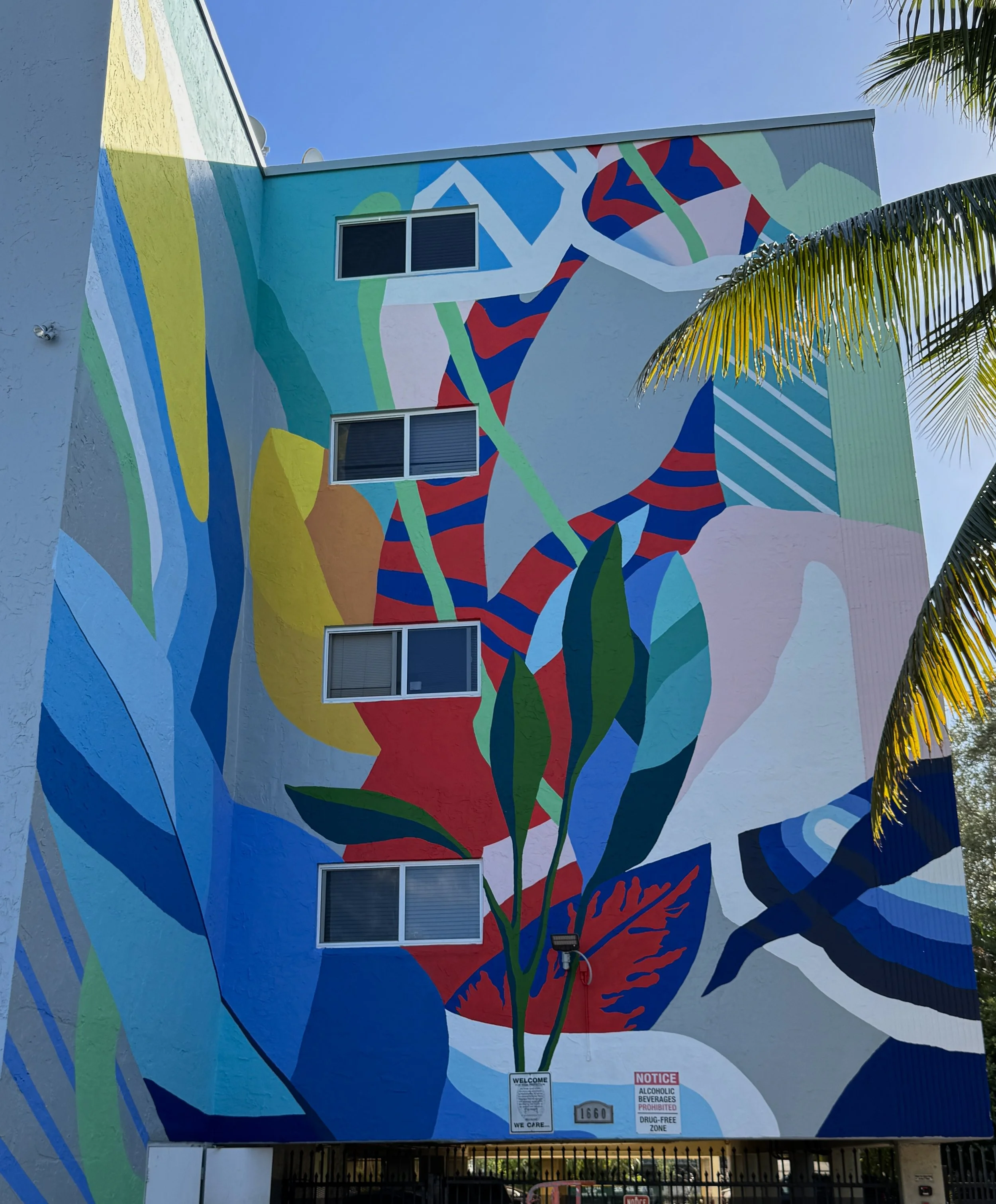 Four-story tropical abstract mural on an apartment building in South Florida