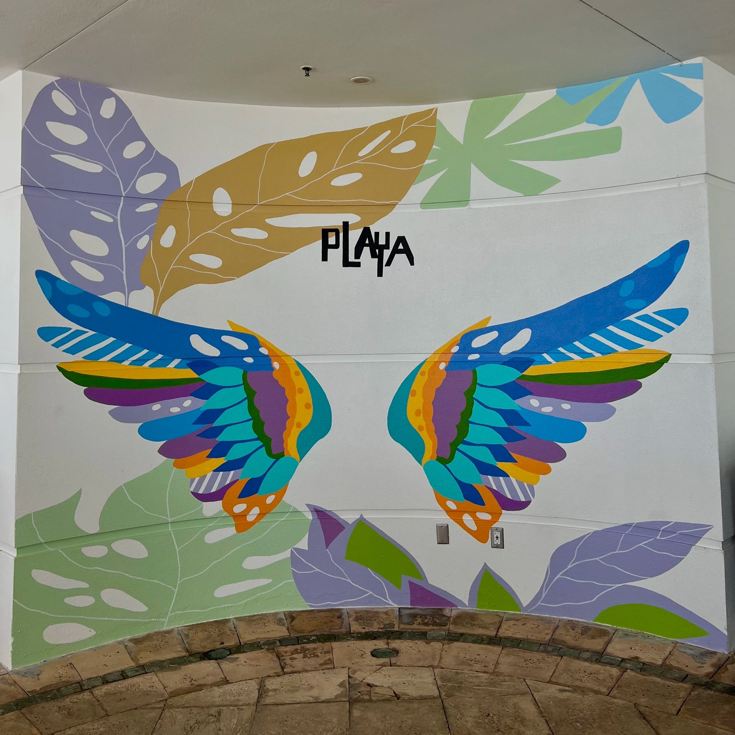 Interactive tropical wings mural created for a Florida hospitality property