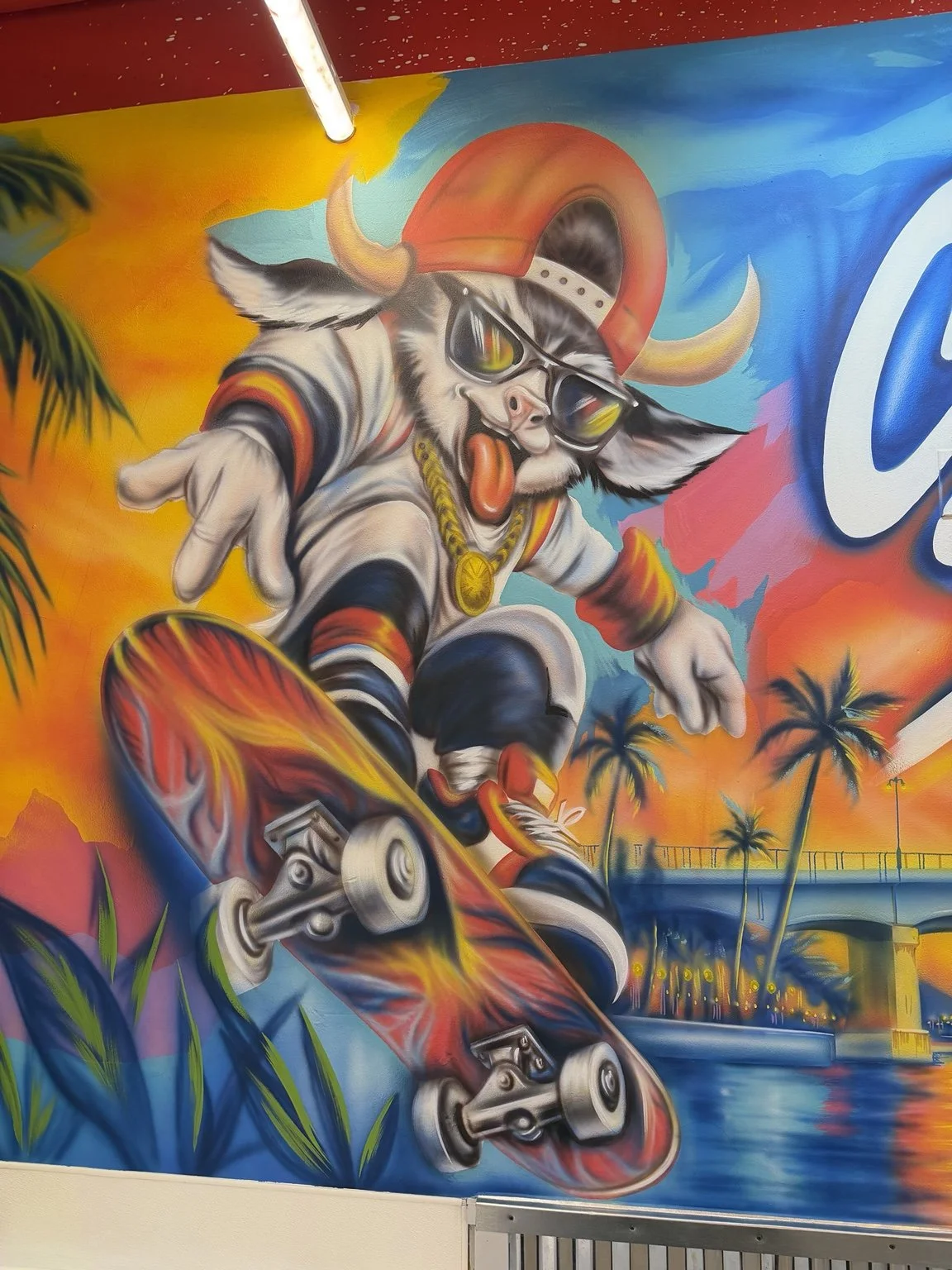 Close-up of the skateboarding bull mascot in the Cluck N Smash restaurant mural