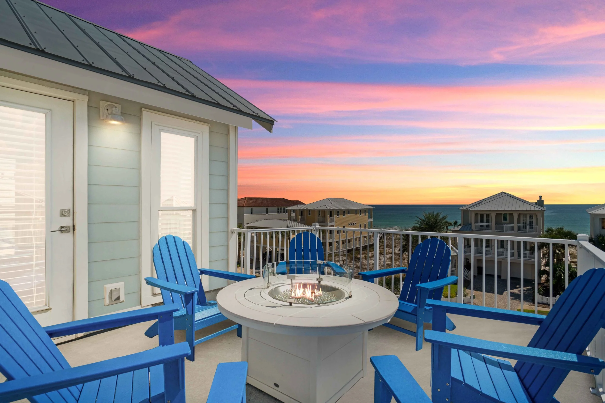 A Beautiful sunset-twilight photo of a rooftop balcony in Destin, Florida 