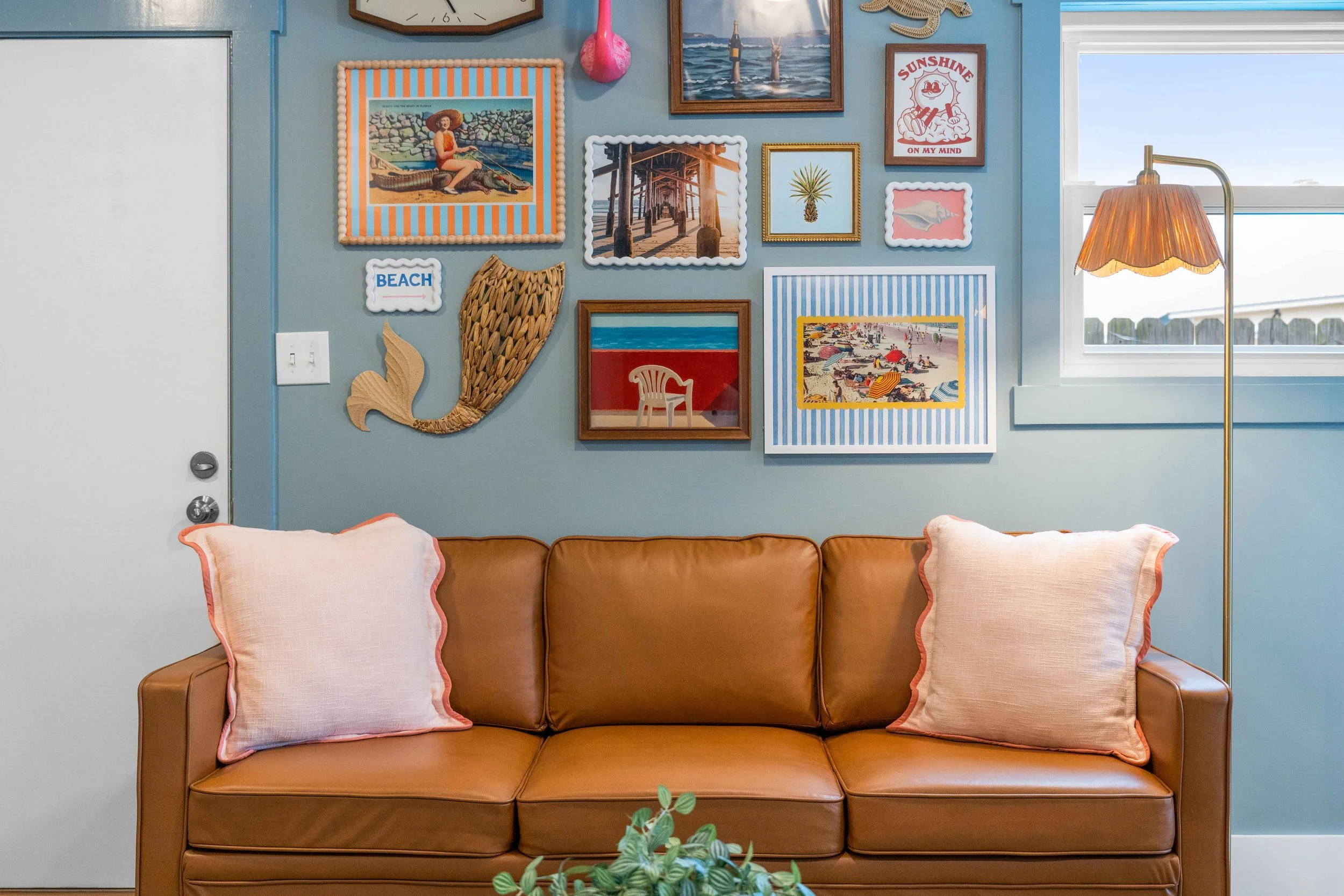 Detailed photo showcasing art work above couch in a Panama City Beach rental property 