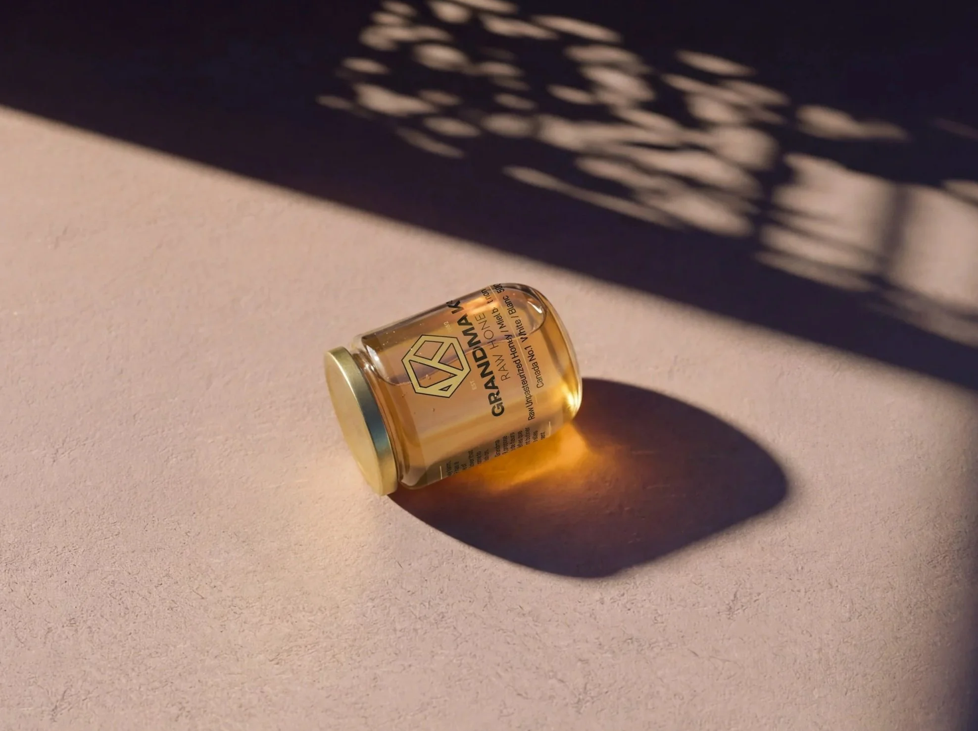 3D Product Render for Grandma K's Raw Honey in Western Canada, featuring the 500g glass jar of raw honey