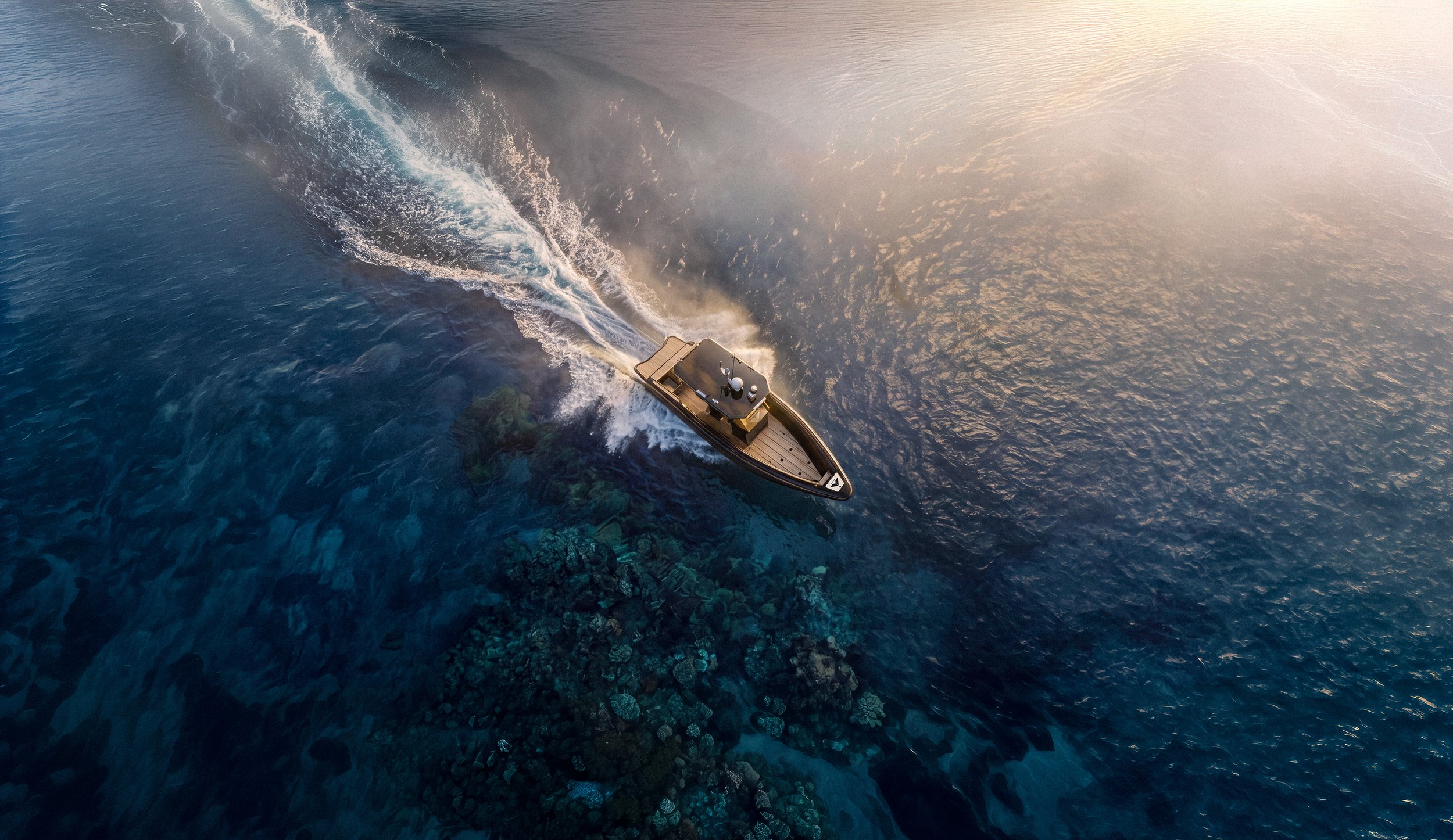 Voltari electric speed boat driving across the ocean at sunset, creating a spray of water behind it.