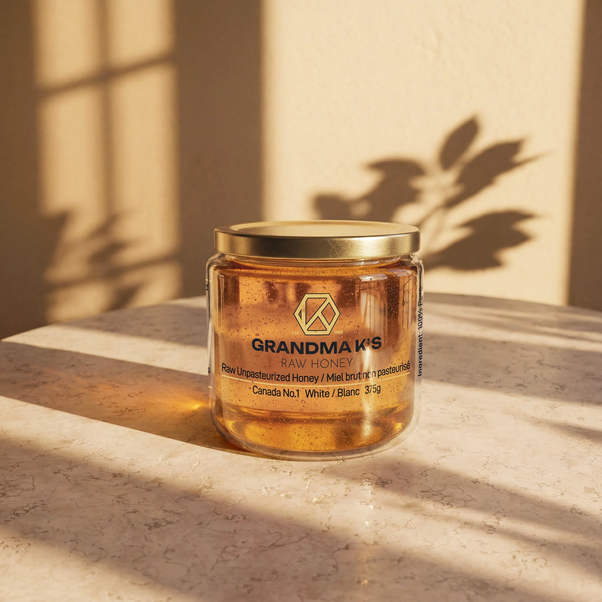 Product render of small glass jar of liquid honey from Grandma K's Raw honey