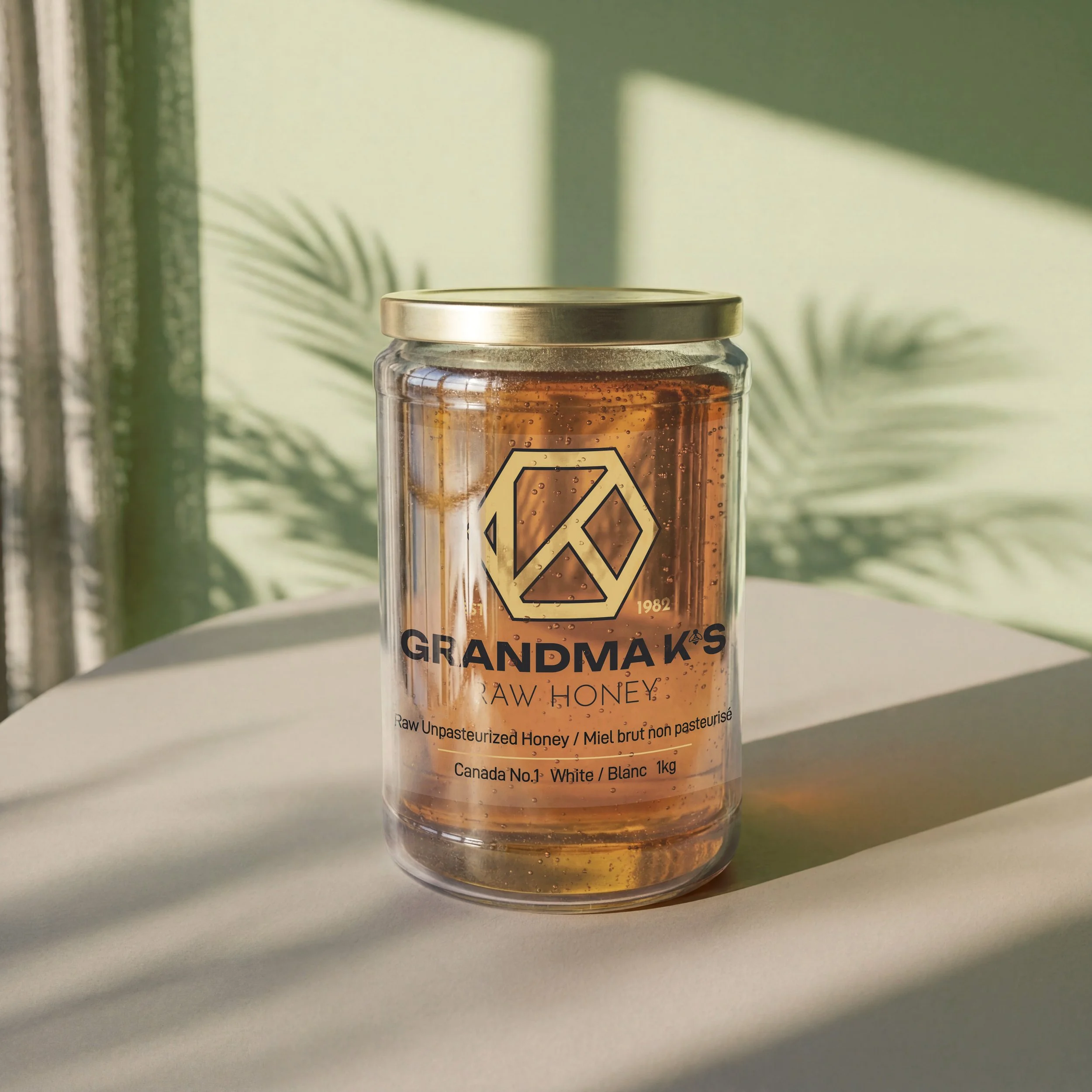 Product render of glass jar of liquid honey from Grandma K's Raw honey