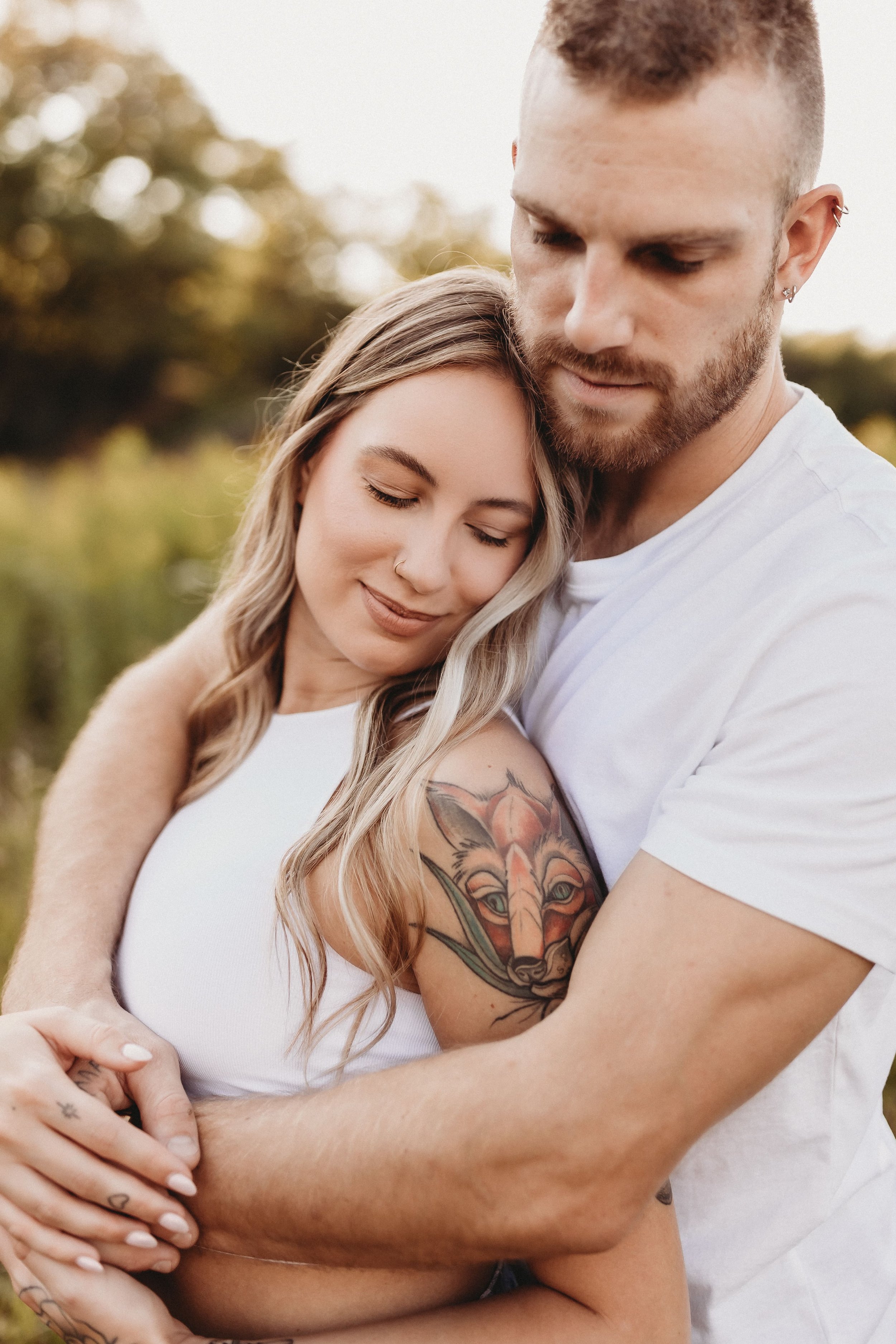 Young Couple Husband And Wife Posing With A Bouquet Of Colorful Flowers In  The Studio On A White Background Stock Photo, Picture and Royalty Free  Image. Image 16292102.