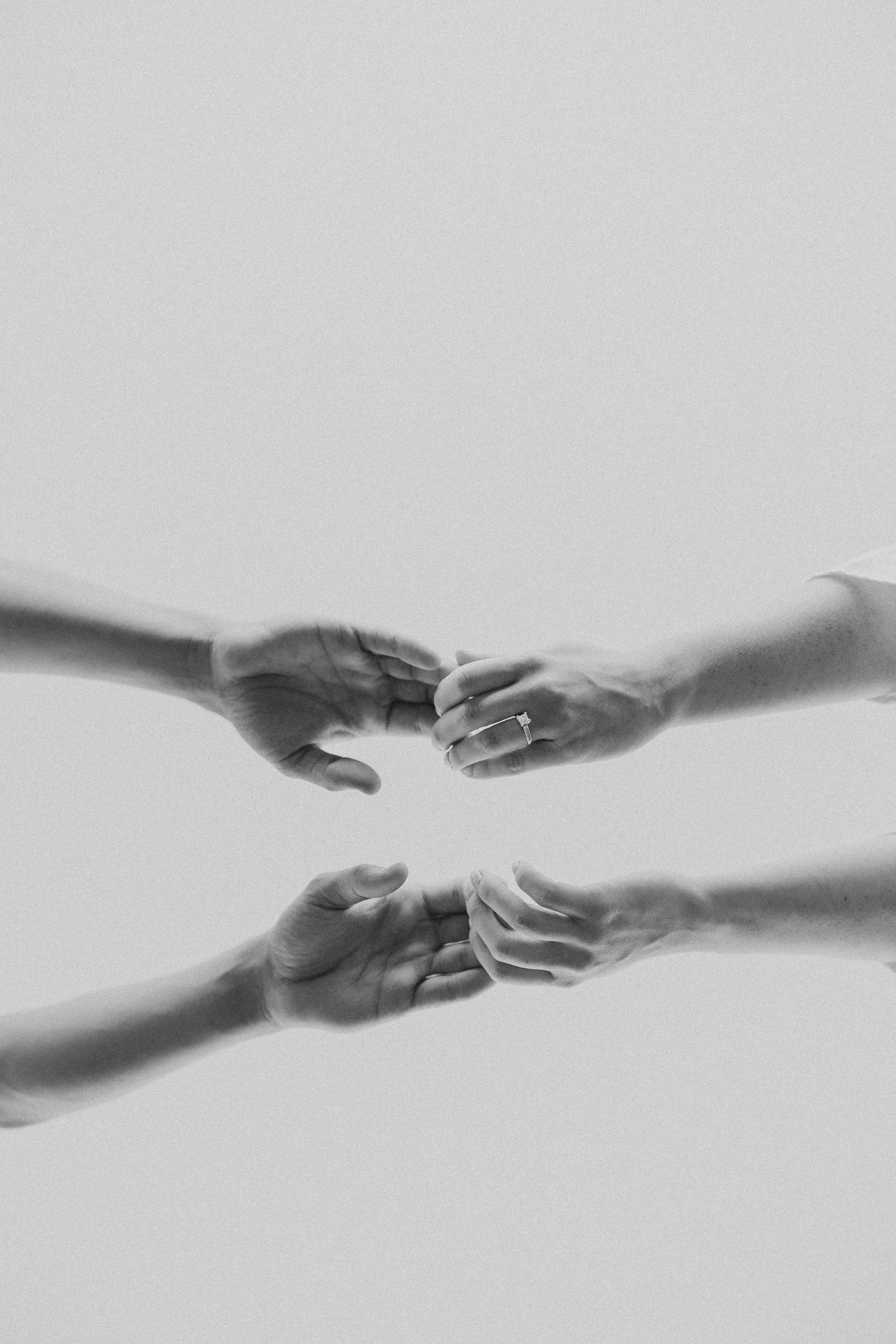  an underneath portrait of a couple’s hands  