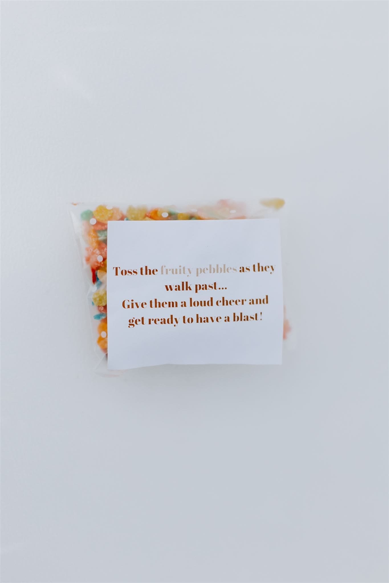  a package of fruity pebbles with a homemade label to toss in place of rice 