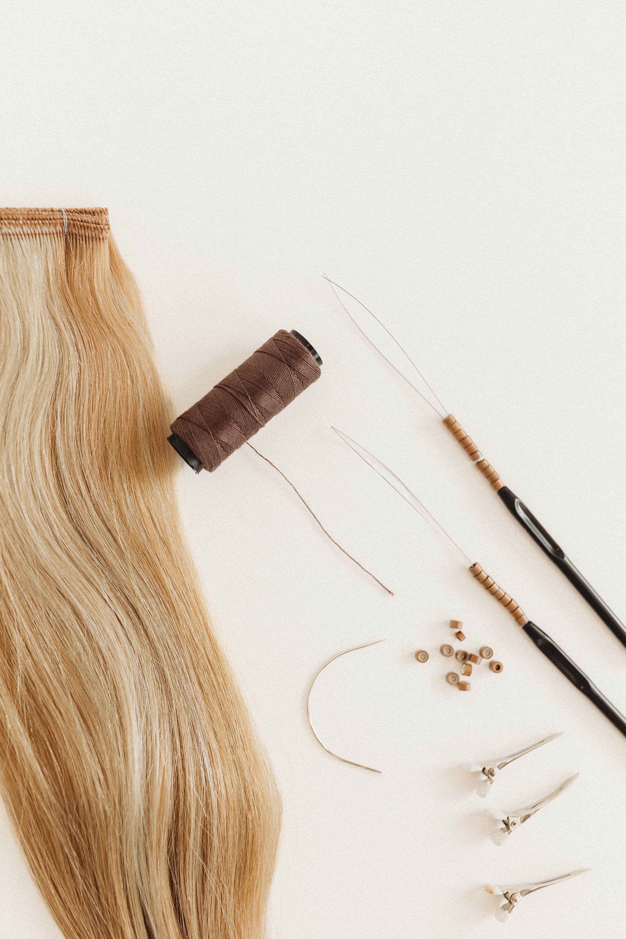  a flatlay of hair extension tools during a stylist photoshoot 