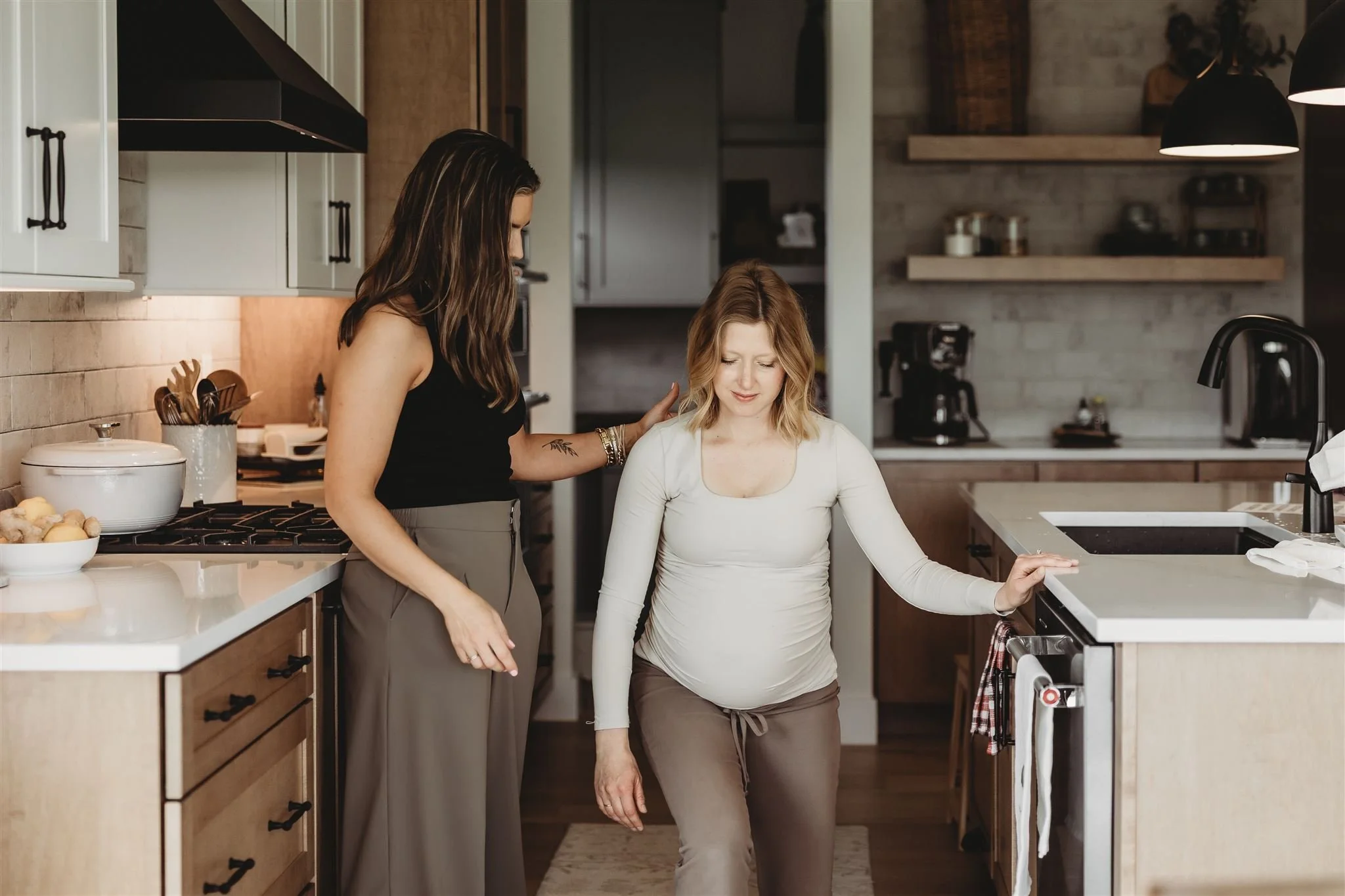 Pregnant woman receiving hands-on support from a Vitality Physical Therapy and Wellness physical therapist at home, demonstrating specialized prenatal physical therapy.