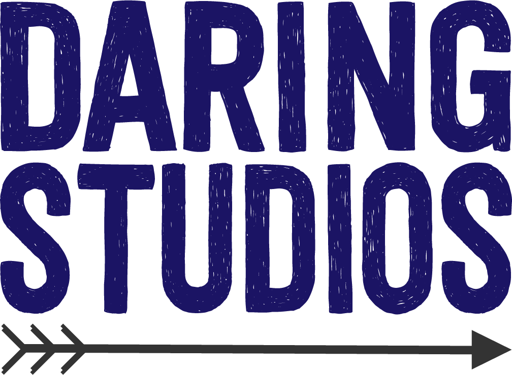 Graphic with the text "Daring Studios" in dark blue capital letters and an arrow beneath it pointing to the right.
