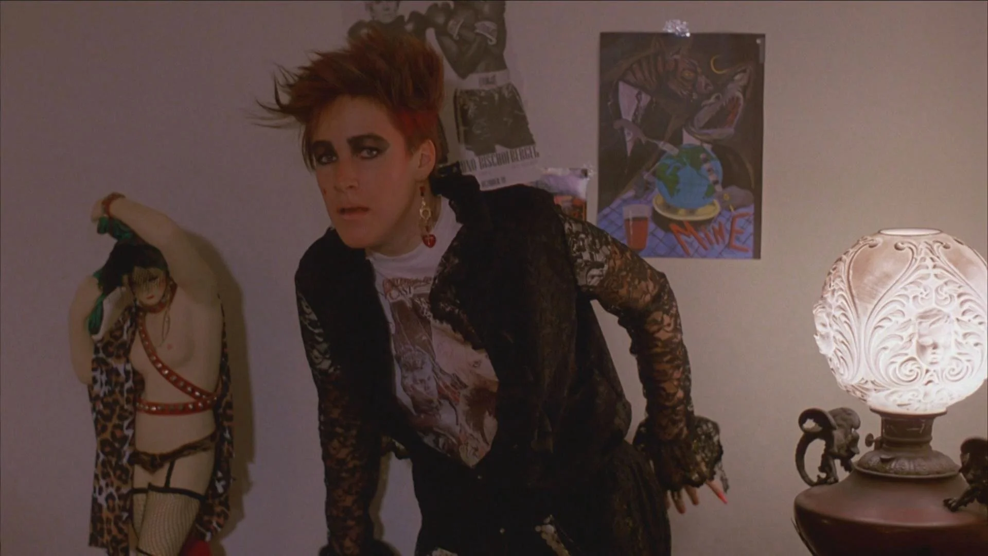 Zarabeth backs against the wall in her apartment in the movie Witchboard
