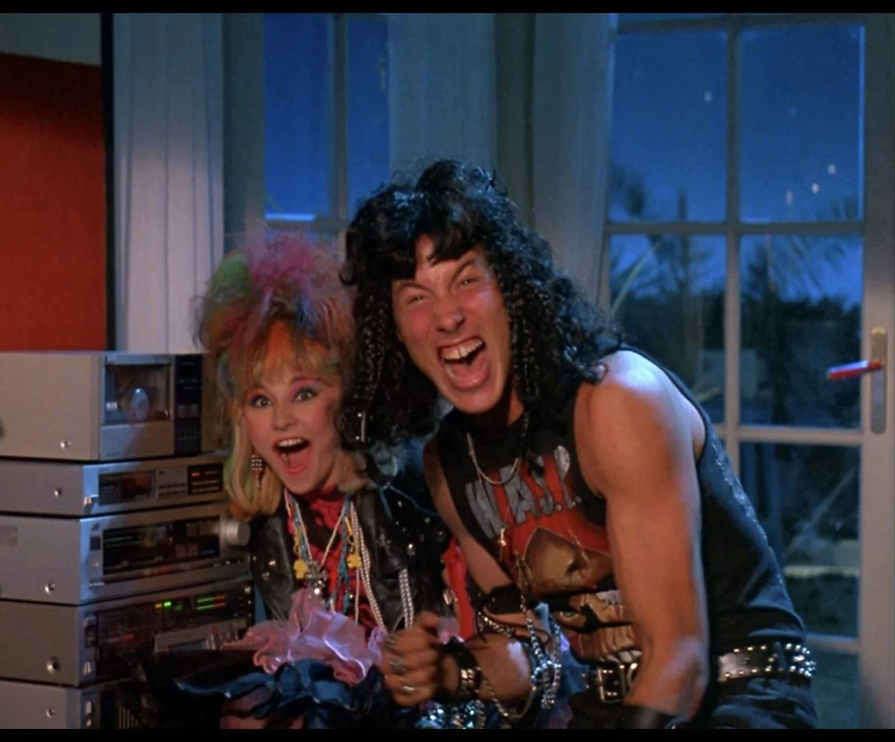 Metalheads Suzy and O.D. in TerrorVision are thrilled as they look on at the alien (out of shot)