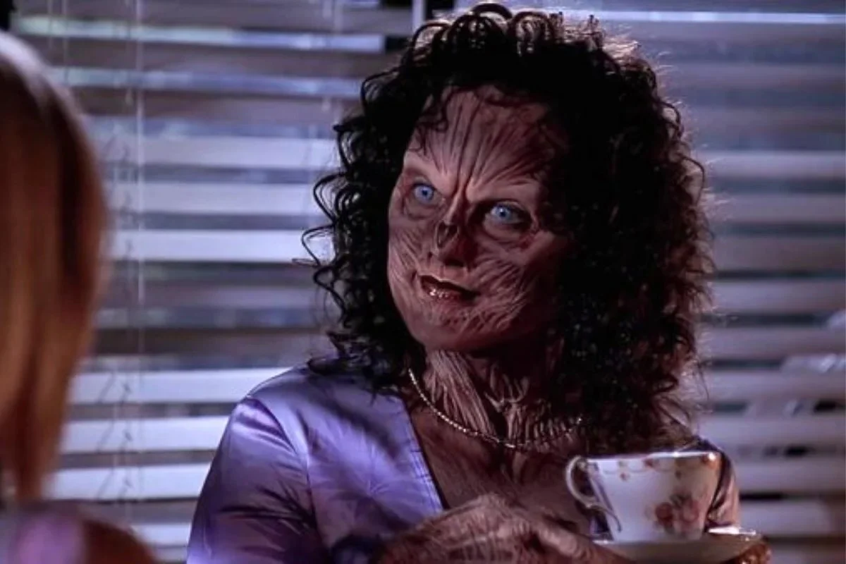 Halfrek holds a cup of coffee in Buffy the Vampire Slayer