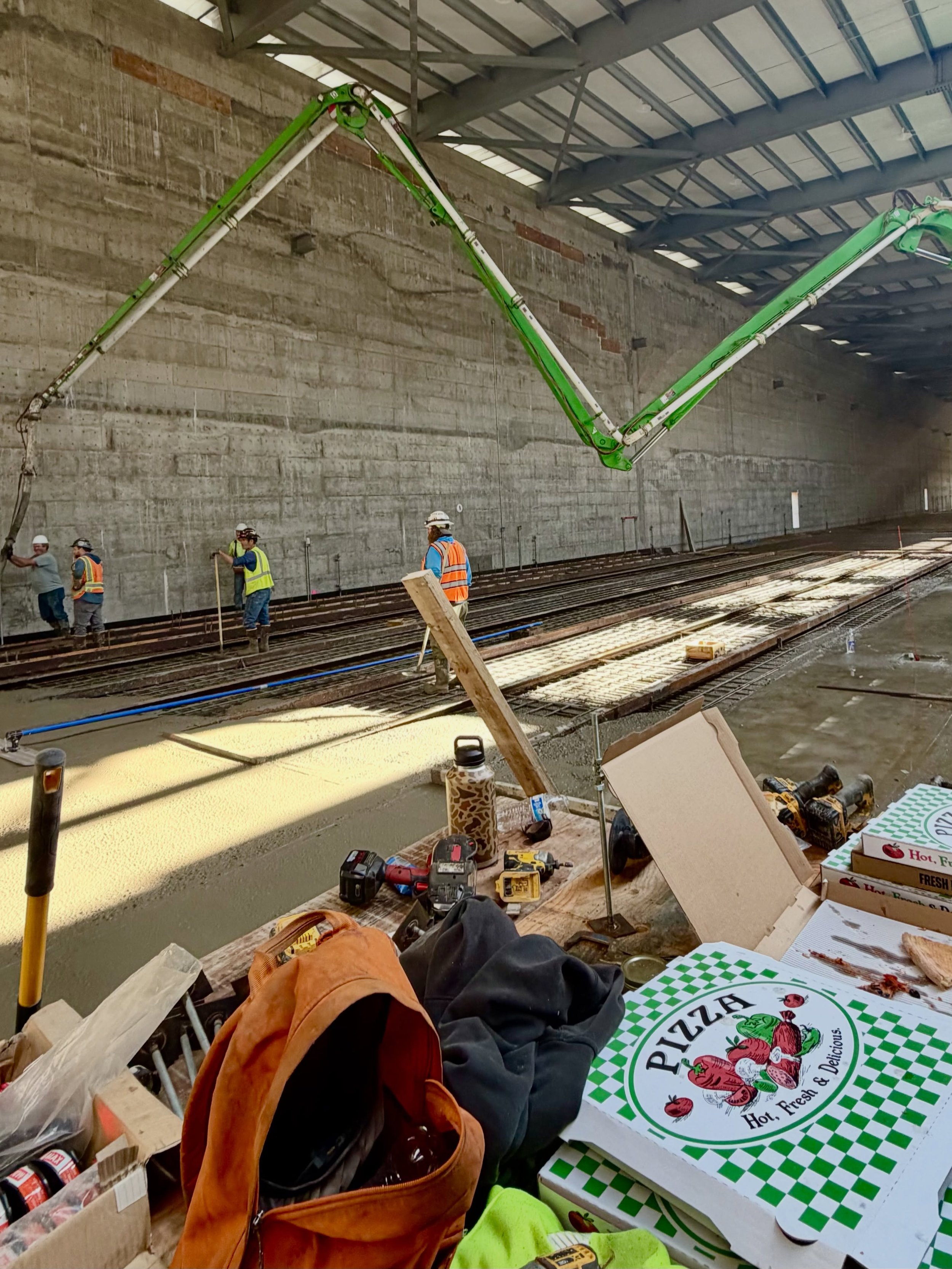 Concrete pumps &amp; pizza. 🍕💪 
Fueling the crew for another #ConcreteStrong day working on the interior of the new @alaskaprecastsolutions plant production hall.

#ConcretePumping #AlaskaConstruction #PrecastPlant