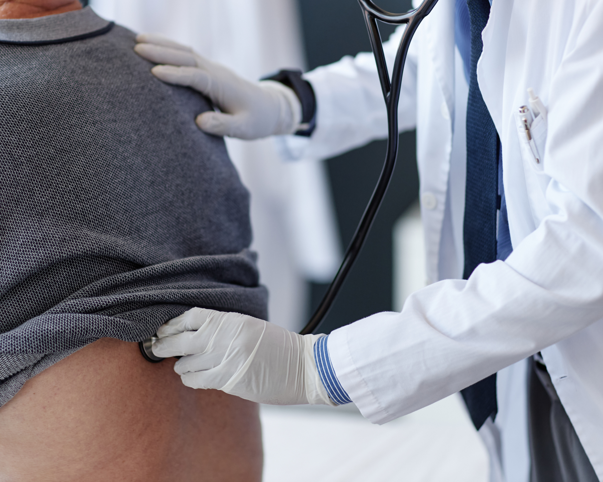 doctor examining patient