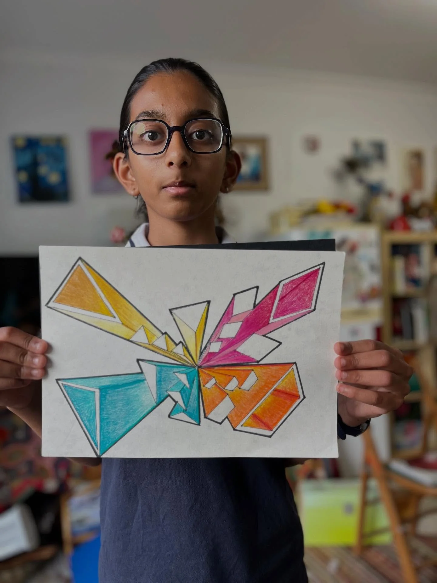 One-Point Perspective | Learning how to create the illusion of depth and space in artwork.
Students began by drawing shapes of their choice and then carefully added shadows to give them dimension. Using coloured pencils, they practiced blending techn