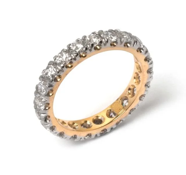 Gold ring with small diamonds encrusted around the entire band.