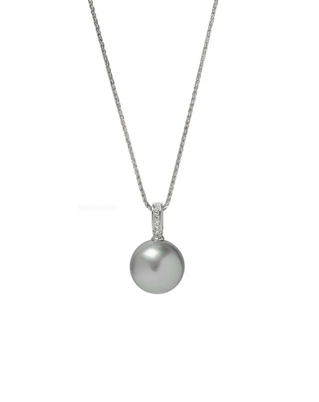 A White gold necklace with a large white pearl pendant.
