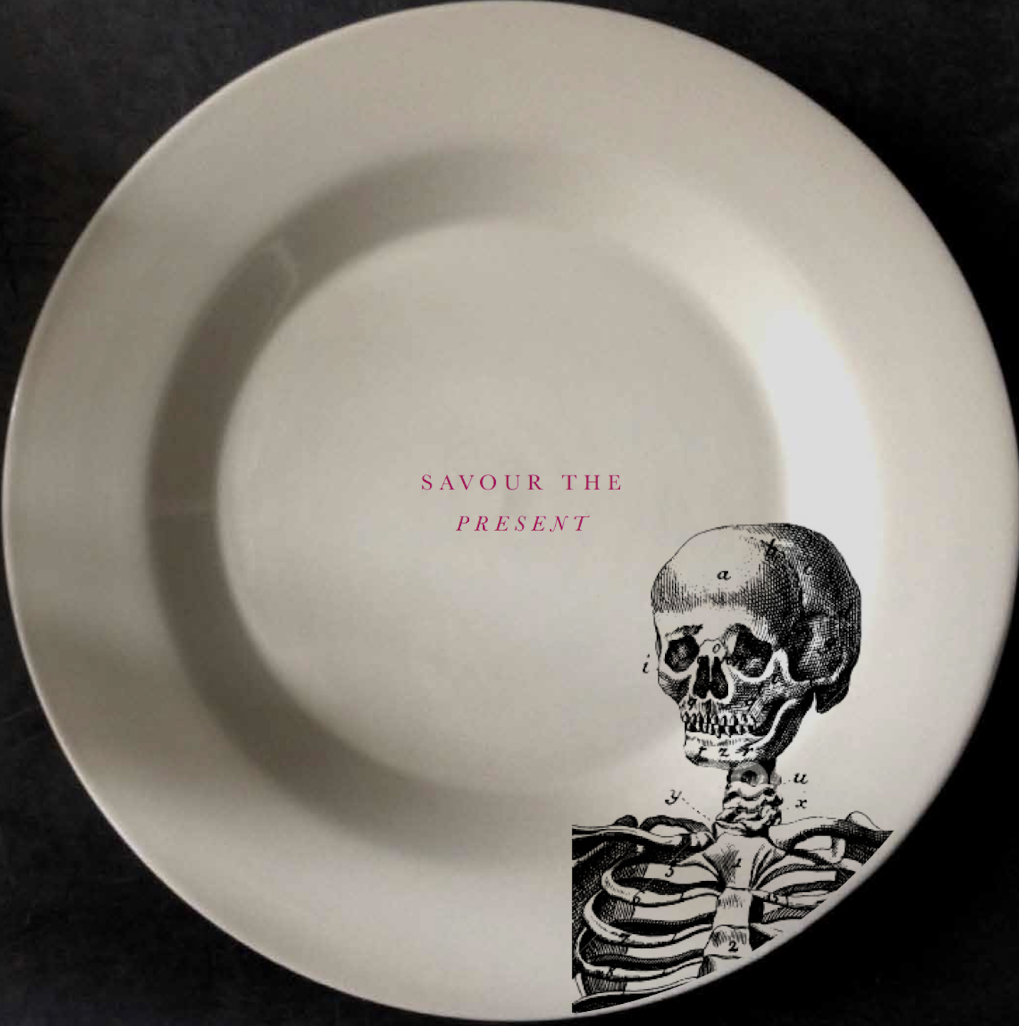 A white plate with a drawing of a human skull and skeleton, along with the pink text 'SAVOUR THE PRESENT'.