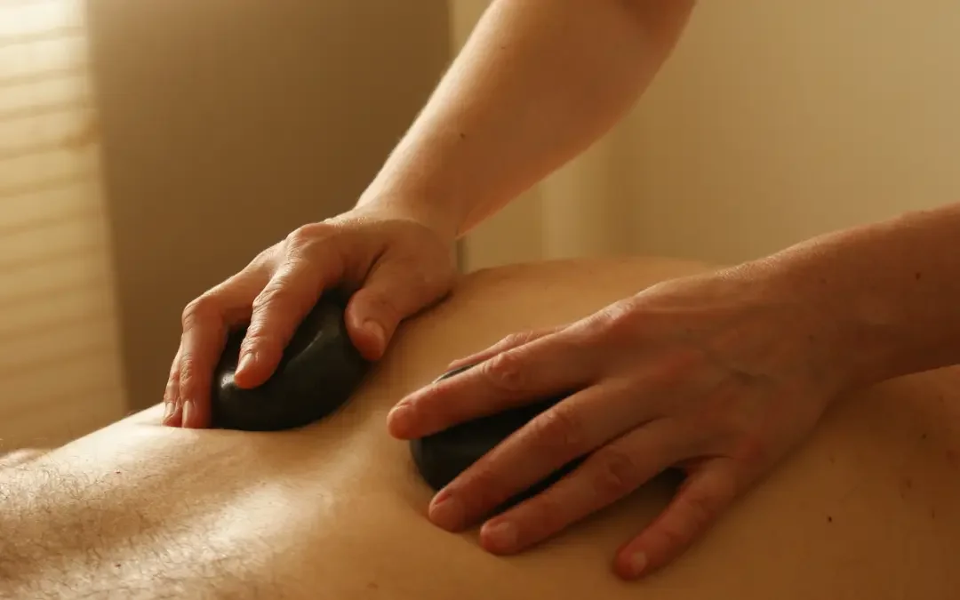 hands-hot-stone-massage-relaxation-275771.webp