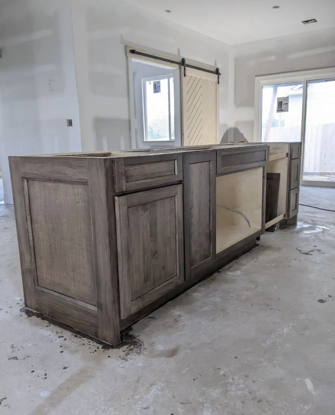 unfinished kitchen island installation in a home renovation project