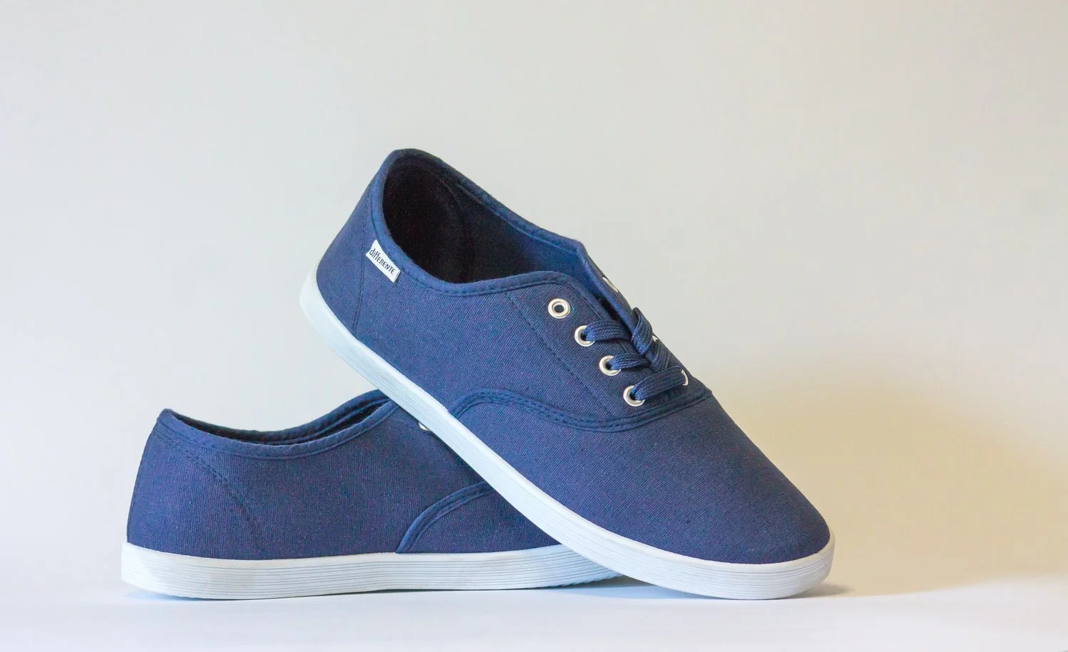 A pair of blue denim cloth shoes.