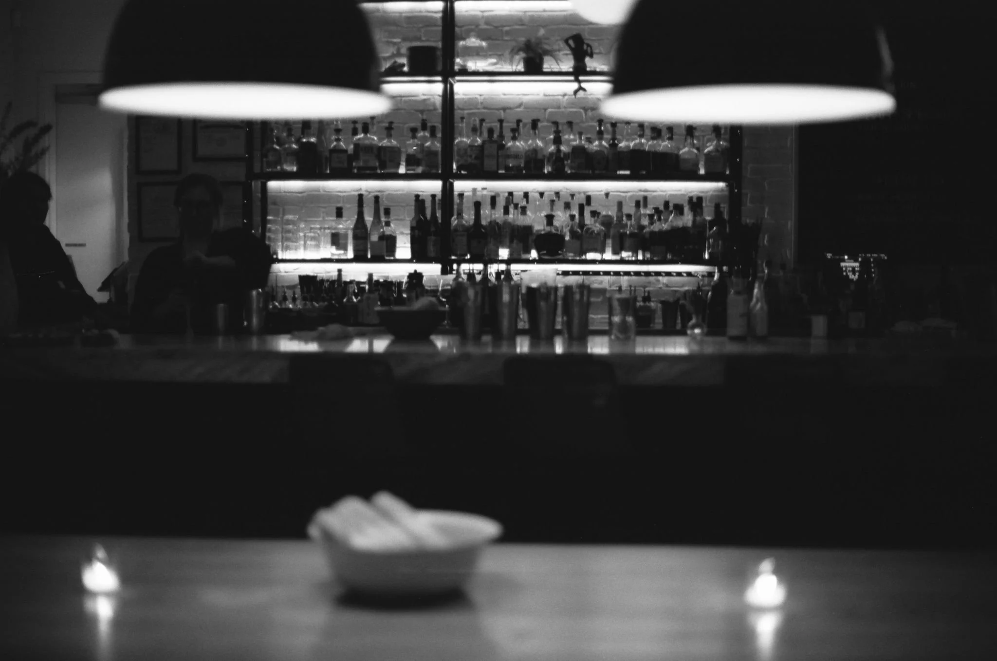 A black and white film photograph of a bar in Nashville Tennessee.