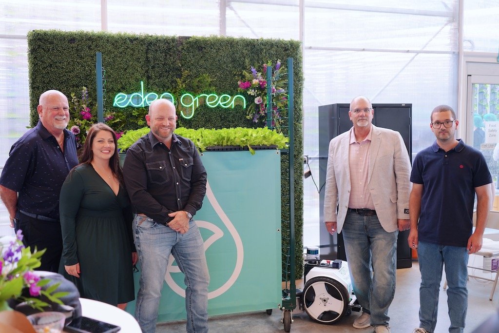 group of people posing at eden green technology grand opening event.jpg