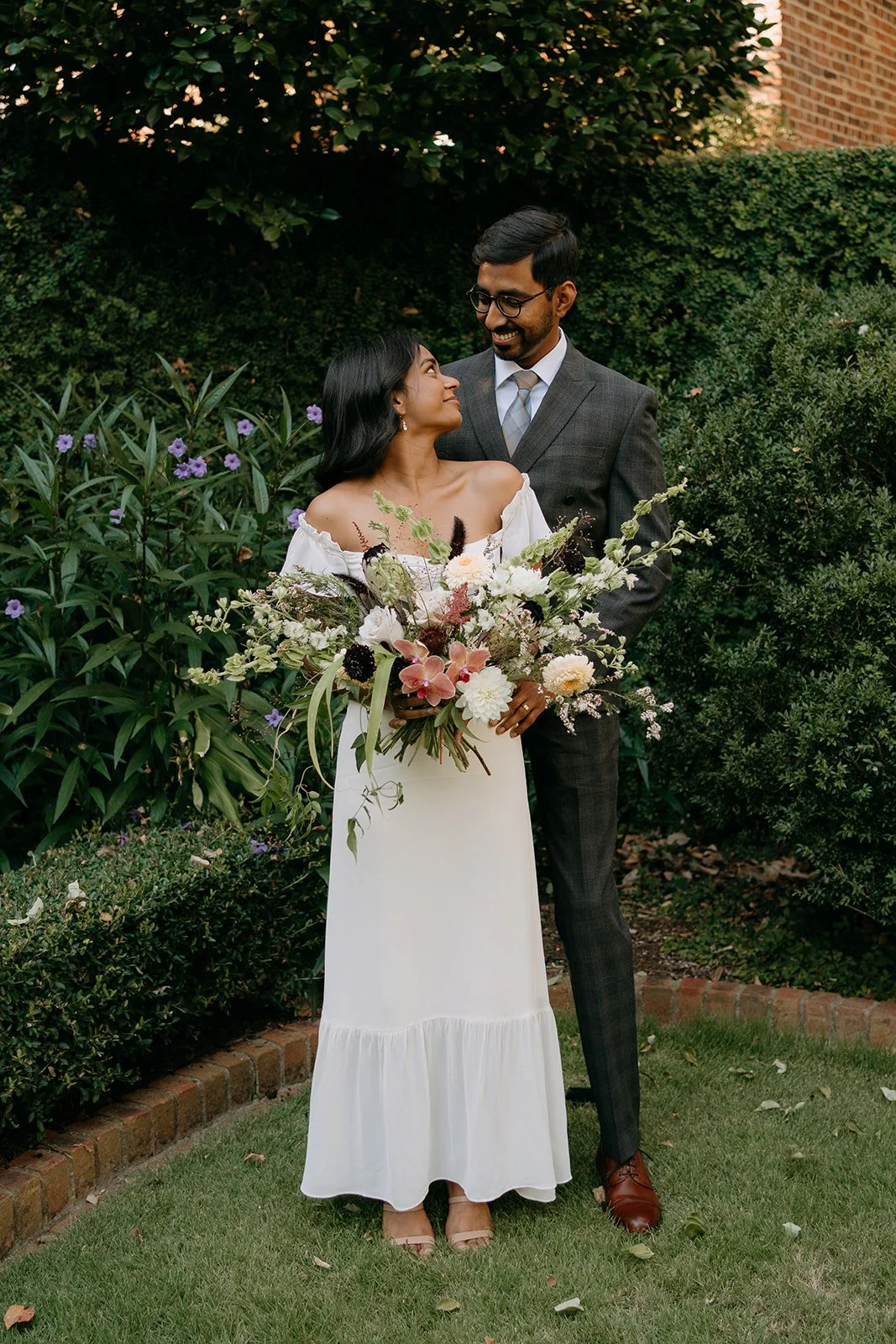 bride and groom with large bridal bouquet
