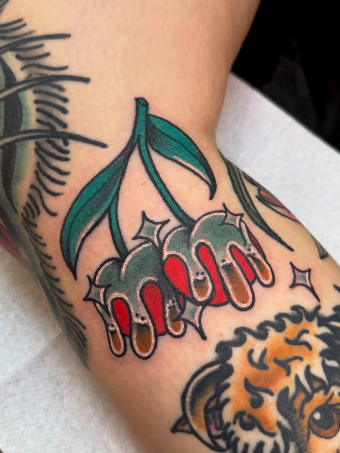 chrome cherries off of my flash made to fit around other tattoos done by me on my long time client Erin 🫶 ✨ thank you for being the coolest and always getting the coolest tattoos with your cool ass family &mdash; did I mention you guys are super coo