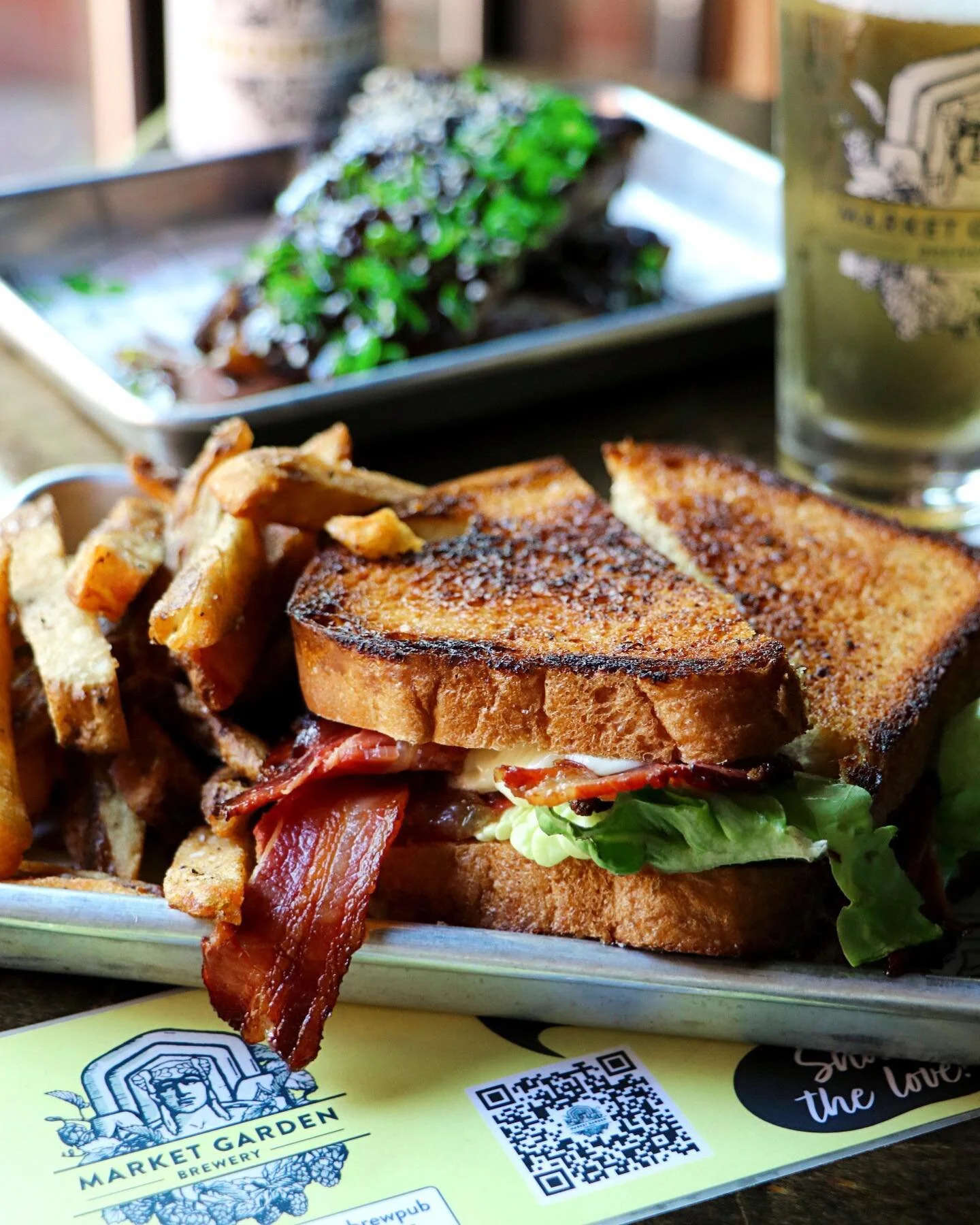 A timeless combination &mdash; Ohio tomatoes, Dee-Jay&rsquo;s bacon, lettuce, and aioli on a house white bread. #Brunch starts at 11am. Come since your teeth into the perfect brunch BLT. #marketgardenbrewpub #marketgardenbrewery #ohiocity