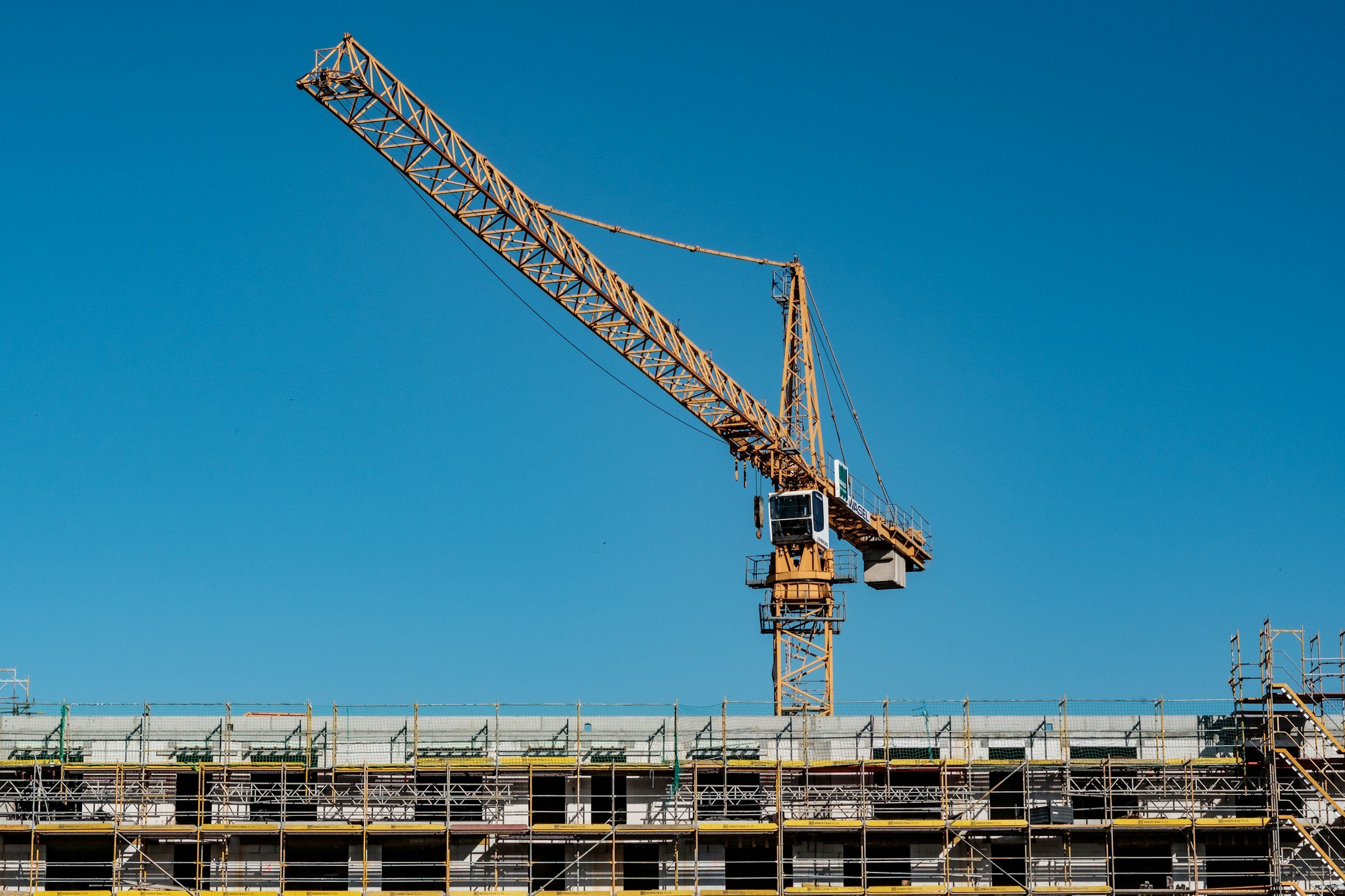 Tower crane over a commercial building under construction, covered by builder's risk insurance