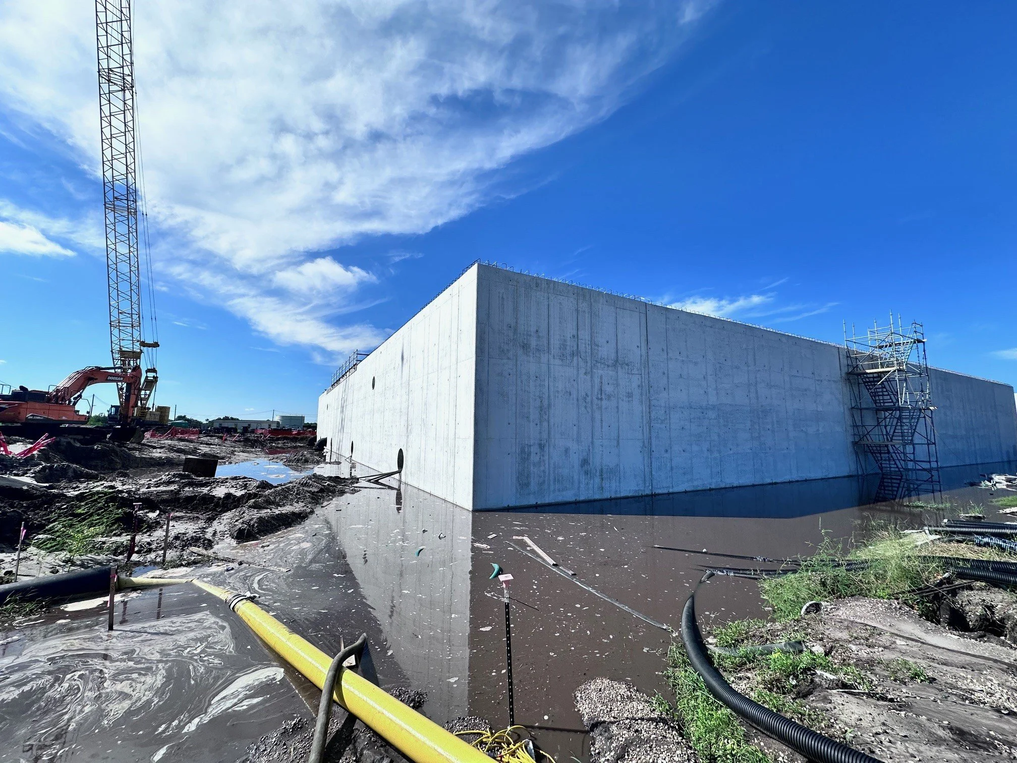 Masons going vertical on the O&M building exterior walls
