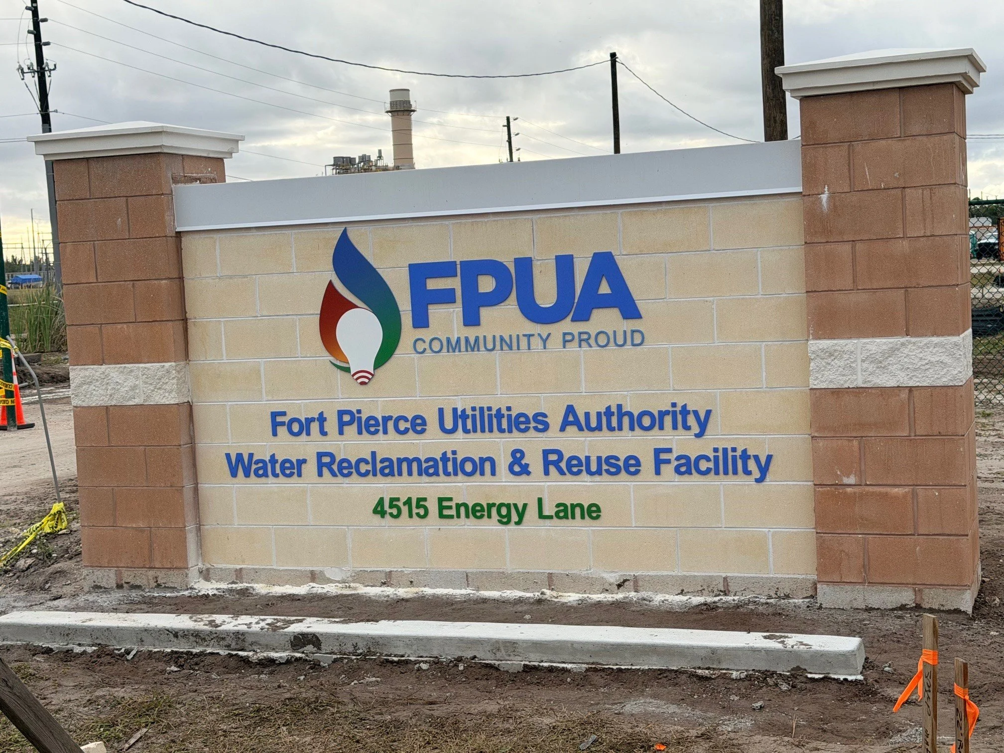 Crews laying down curbs and landscaping