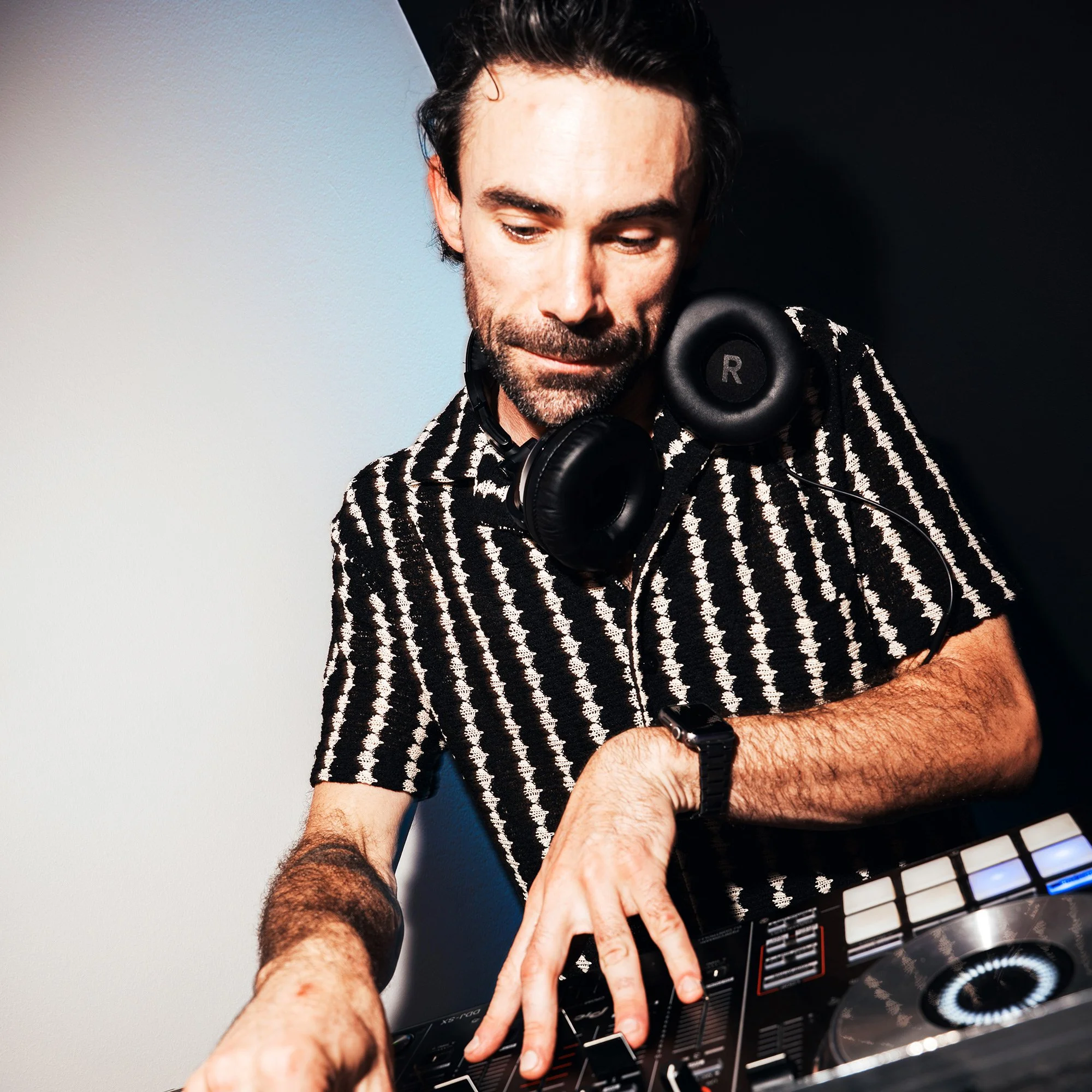Groove Approved DJ mixing live music during a wedding, corporate event, or private celebration.