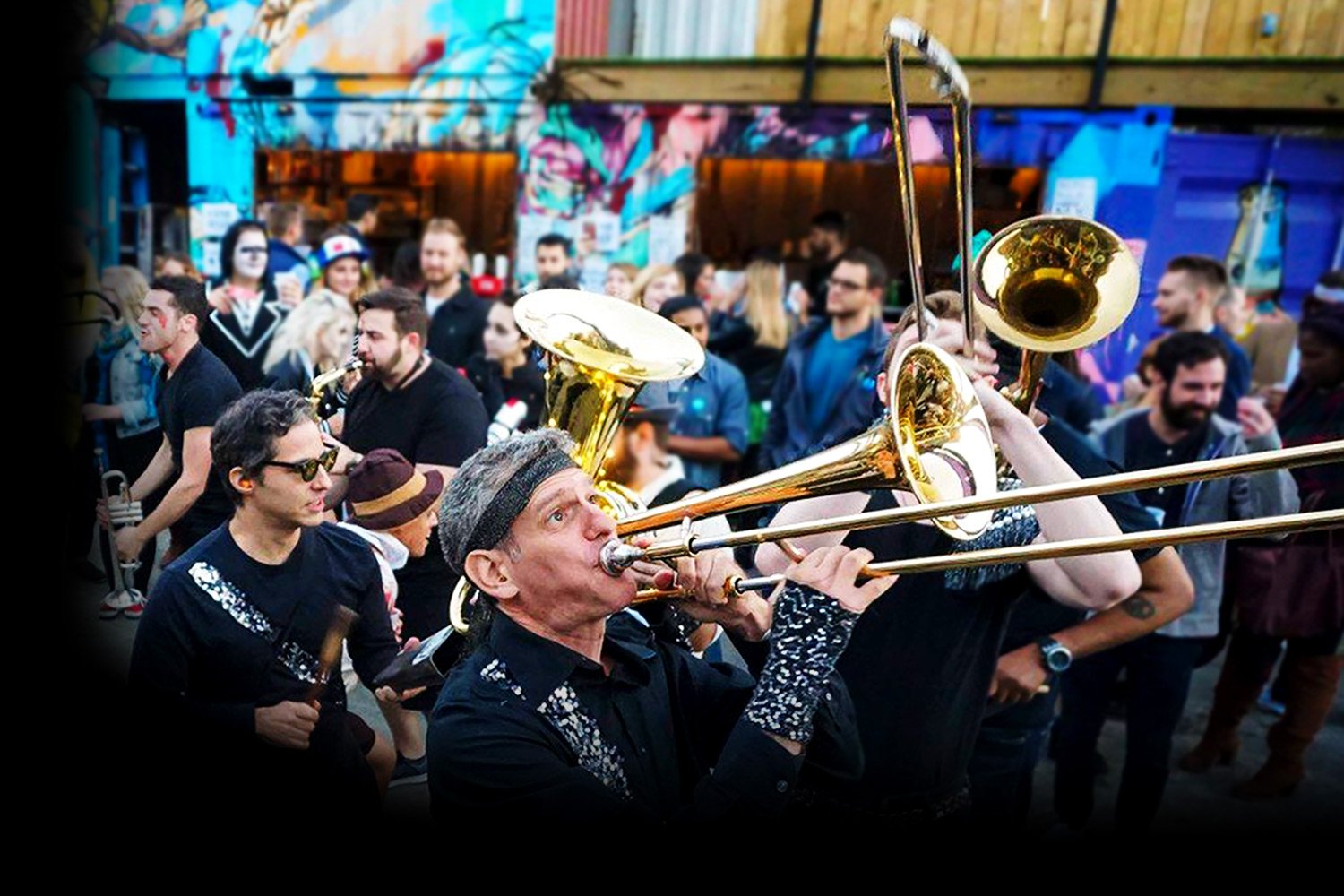 Live brass band entertainment performing at a Los Angeles event, creating an interactive guest experience with live musicians and immersive event entertainment.