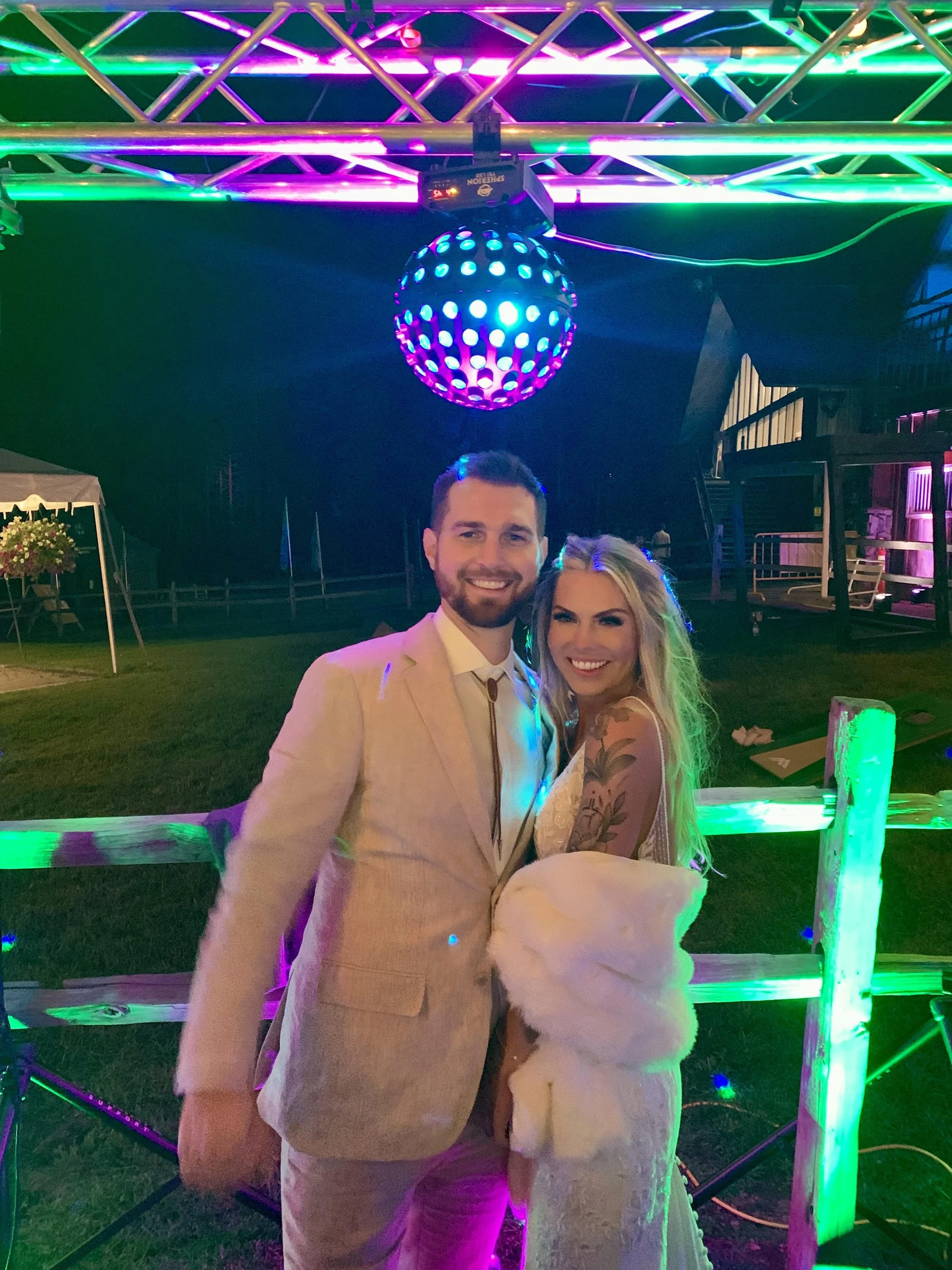 Bride and Groom Under Disco Ball.jpg
