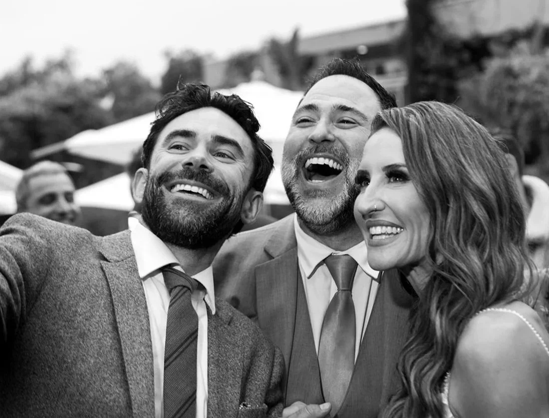 DJ Matty from Groove Approved celebrating with the bride and groom at their wedding reception.