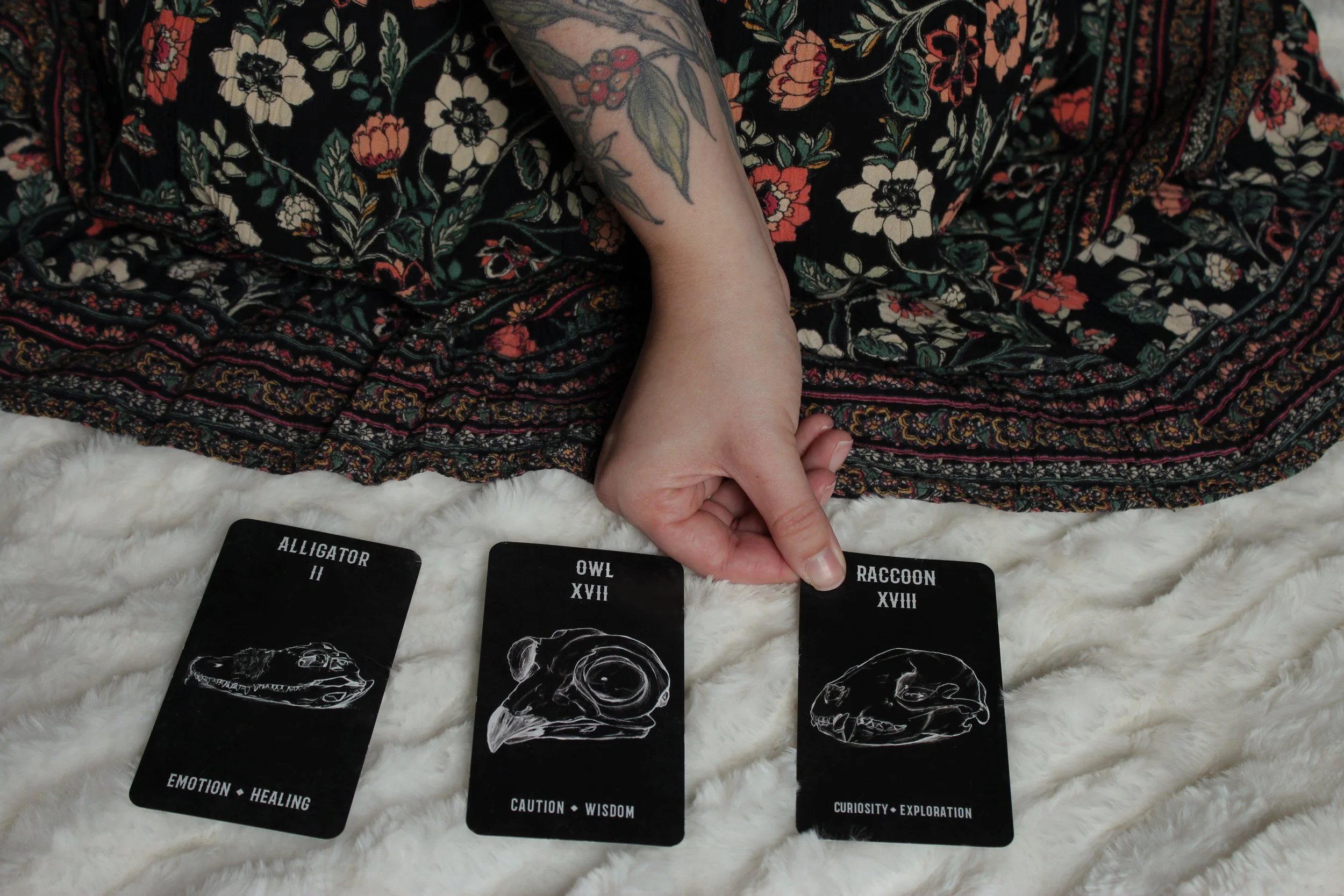 Image of Halle Thomas licensed anxiety therapist laying down oracle cards