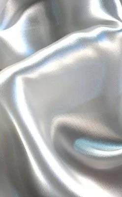 Close-up of shiny silver satin fabric with smooth, reflective surface and soft folds.