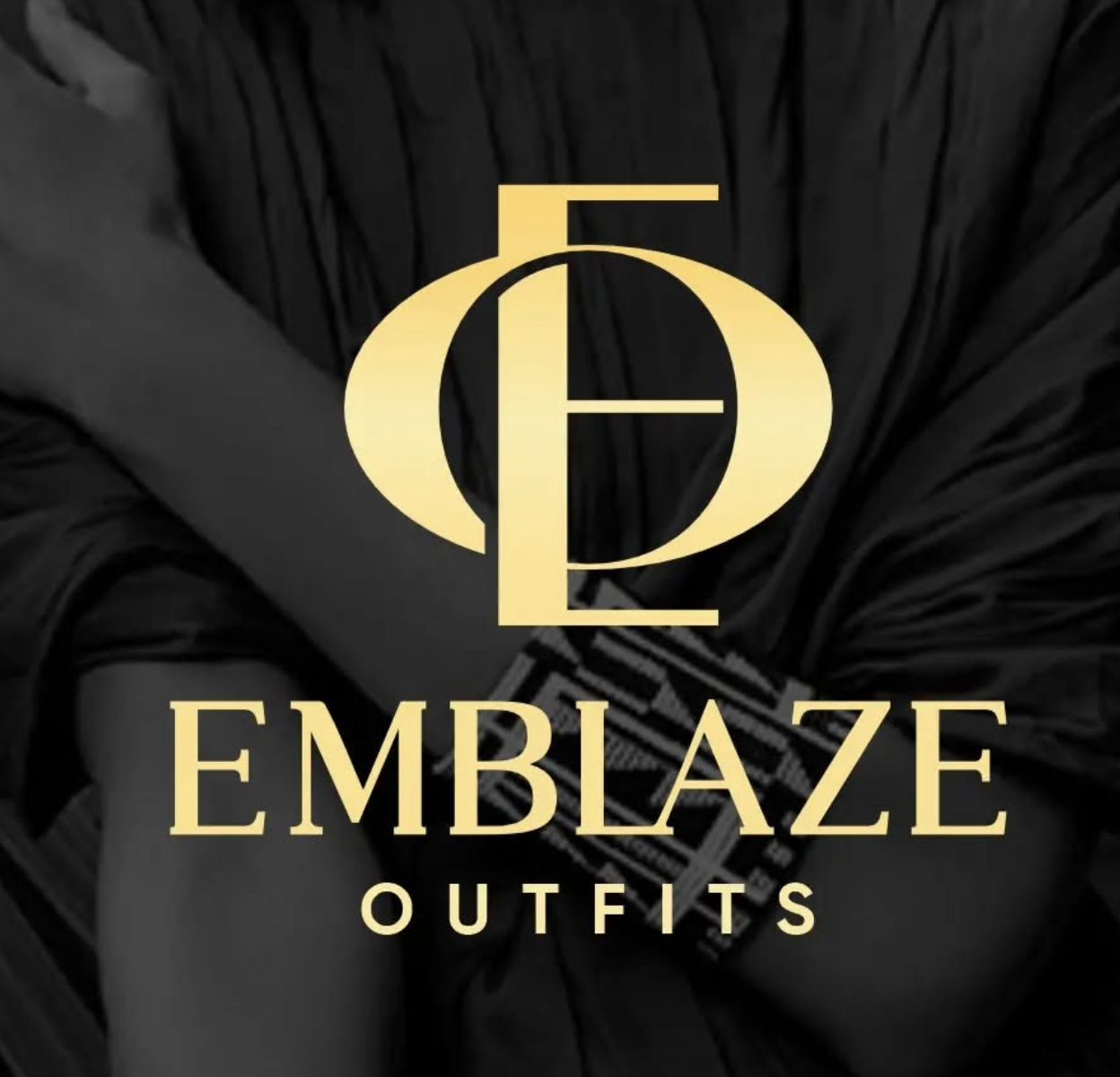 Logo for Emblaze Outfits with a gold emblem and text on a black and white background image.
