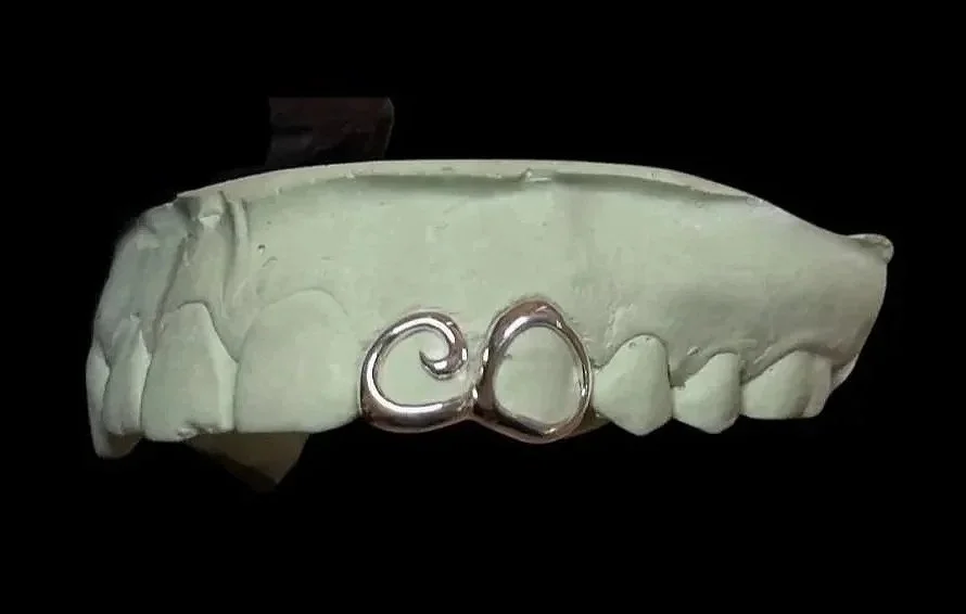 Custom silver grillz in portland, OR. Swirl and window grillz