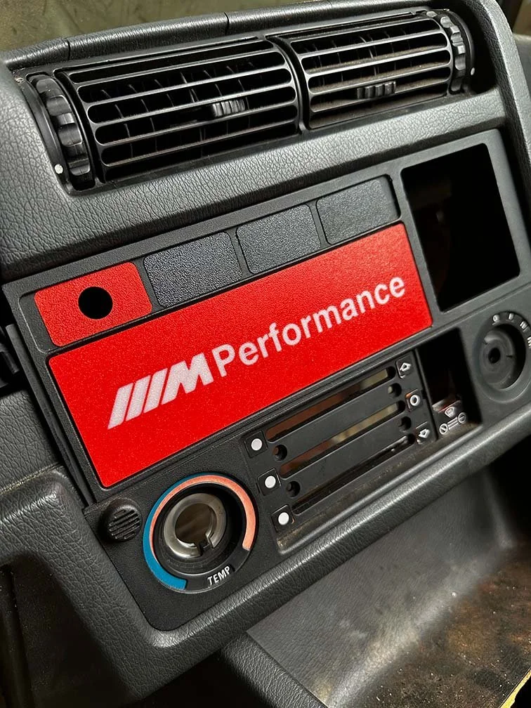 bmw-e30-radio-delete-plate-m-performance-red-installed.jpg